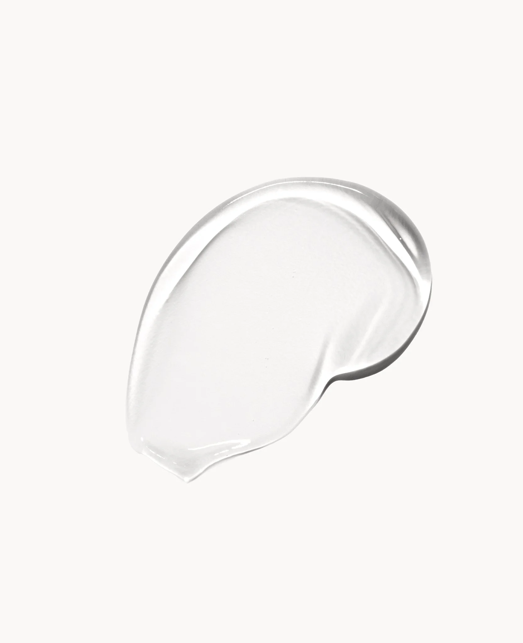 A clear, semi-thick gel-like substance on a white background