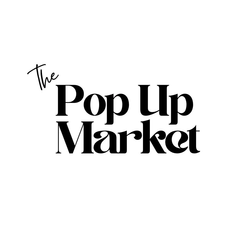 Text graphic reading 'The Pop Up Market' in black font on a white background.