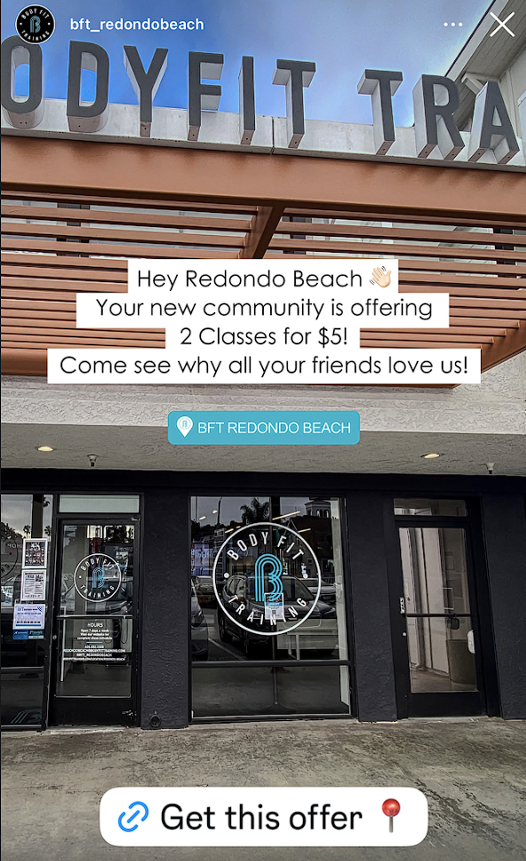 Exterior of a fitness studio called 'Body Fit' with glass doors and a logo featuring a large letter 'B'. A sign on the building announces a special offer for two classes for $5 at BFT Redondo Beach, promoting community engagement and inviting friends to join.
