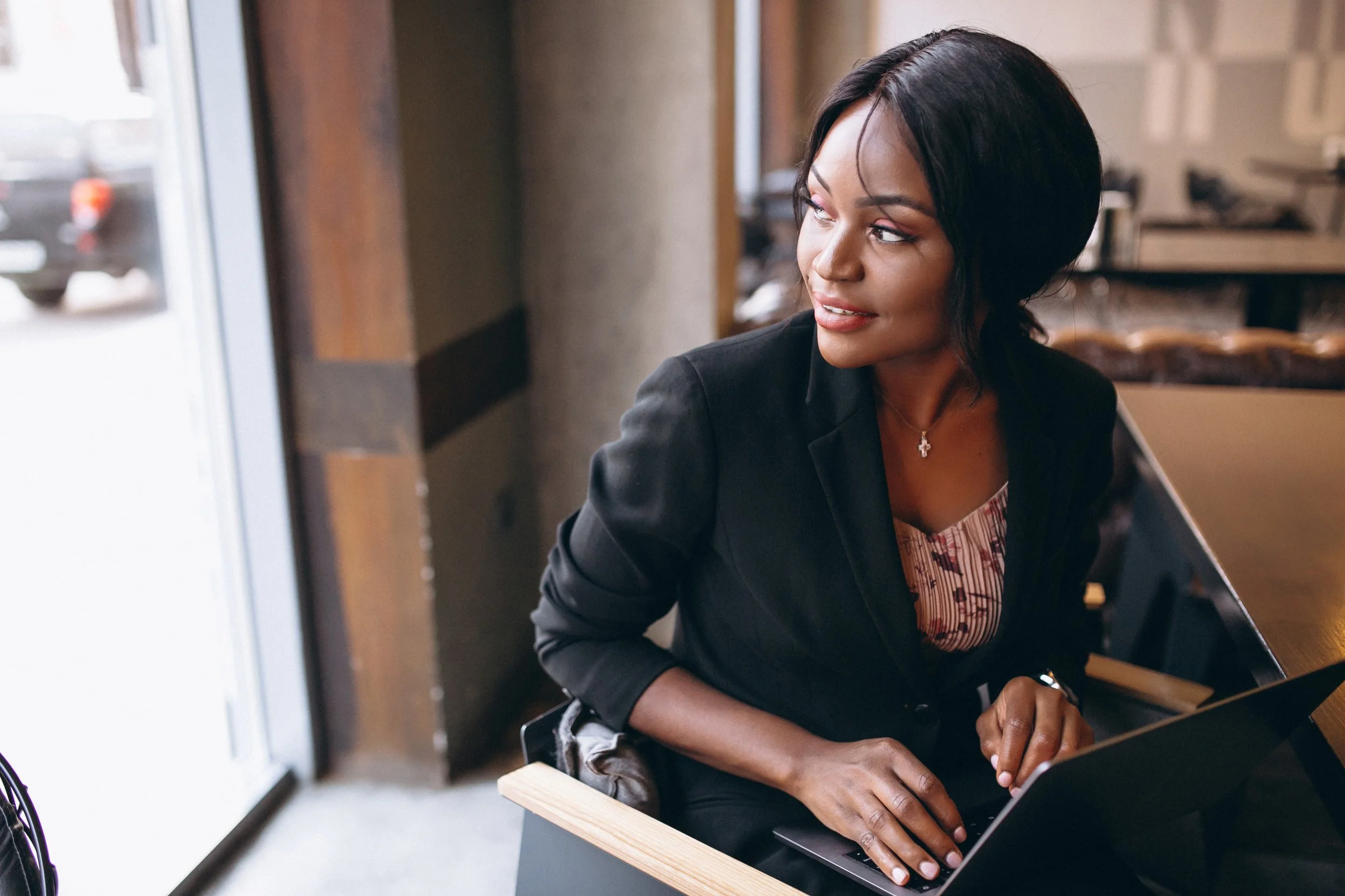 african-american-business-woman-working-computer-bar