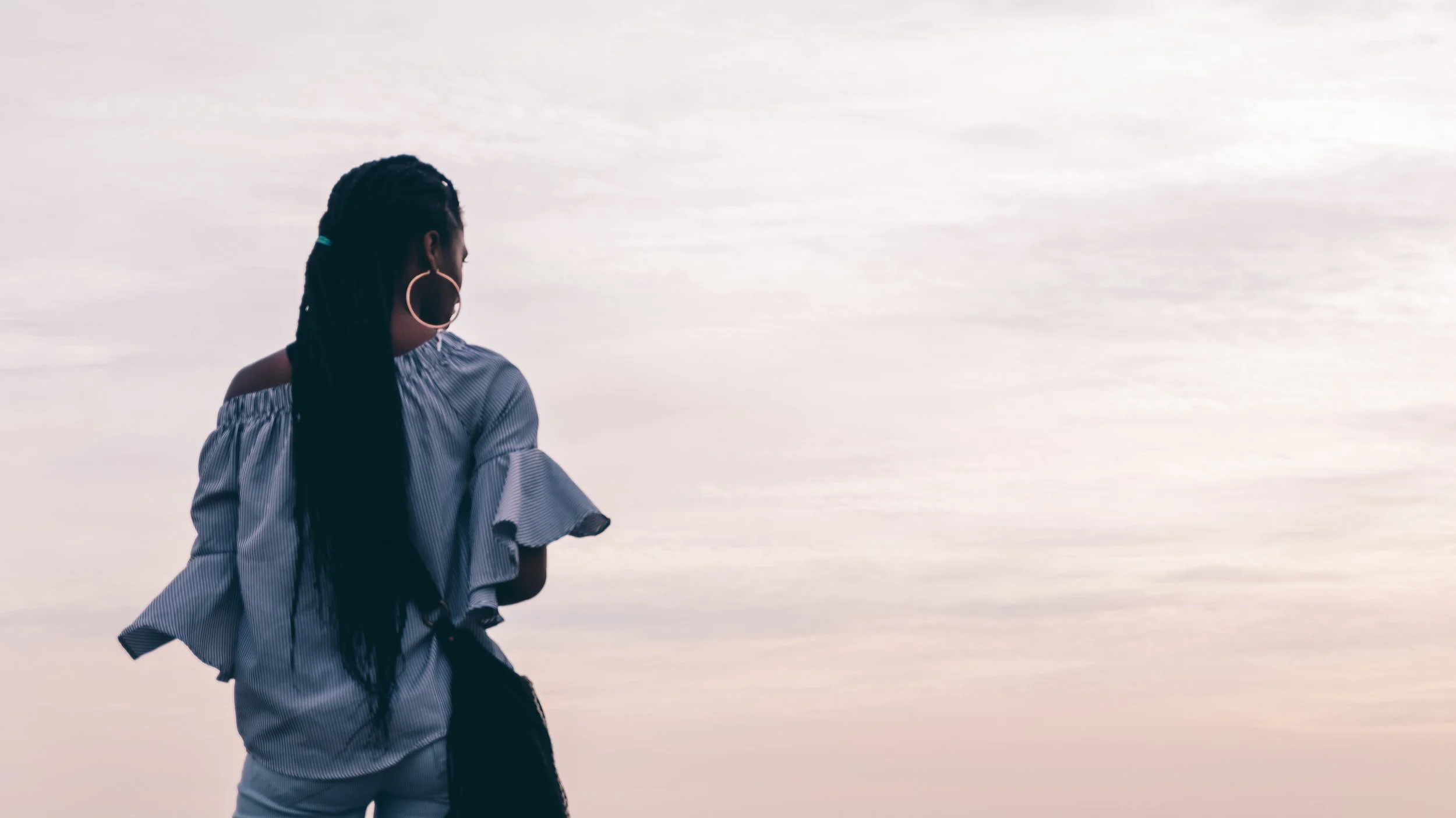 woman-looking-out-at-the-sky