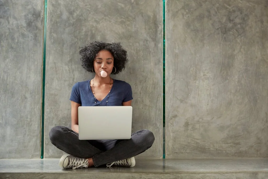 woman-on-laptop-blowing-bubble