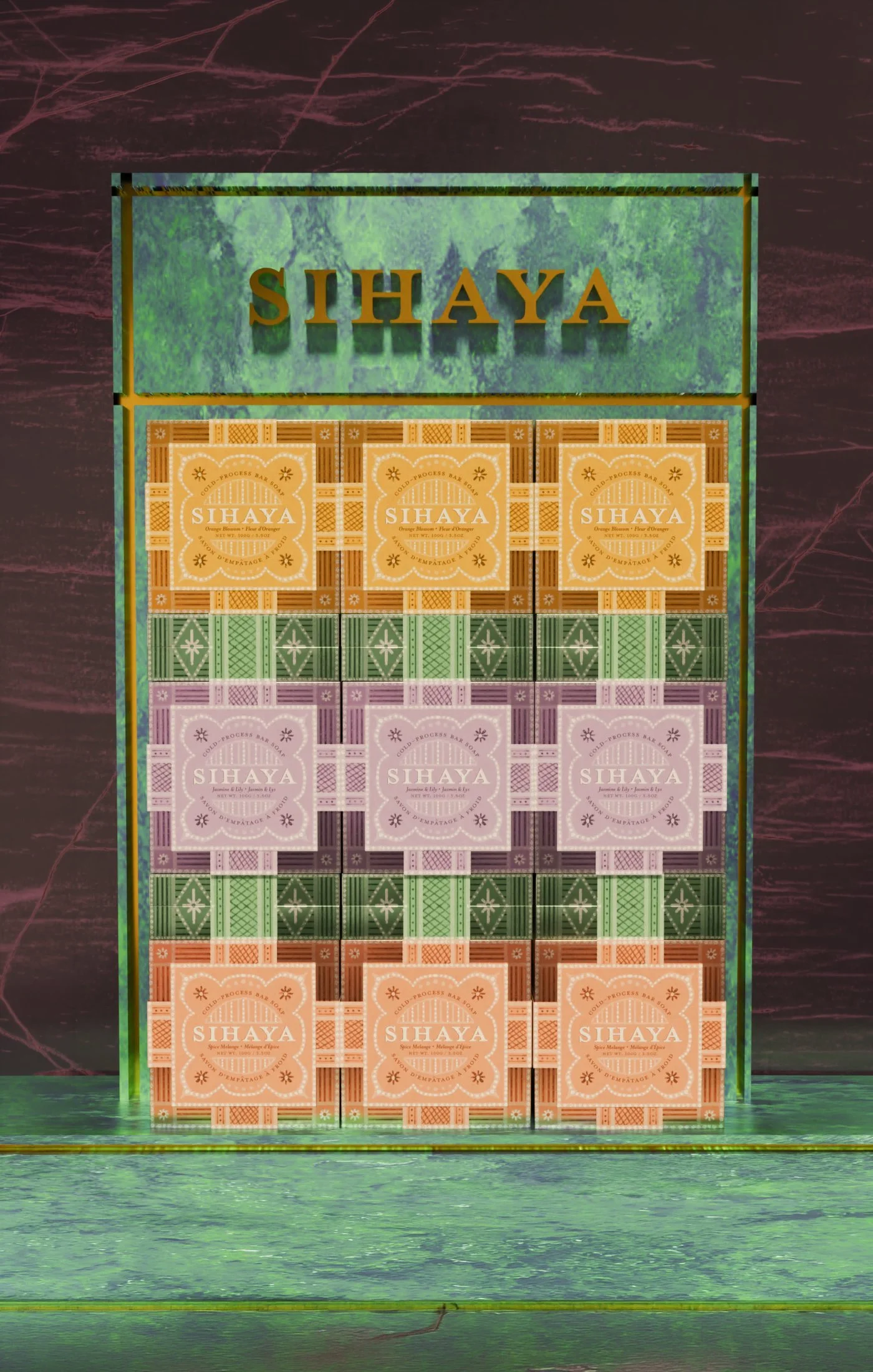 Display of boxed soap bars labeled SIHAYA in yellow, purple, and orange packaging on a green and maroon background.