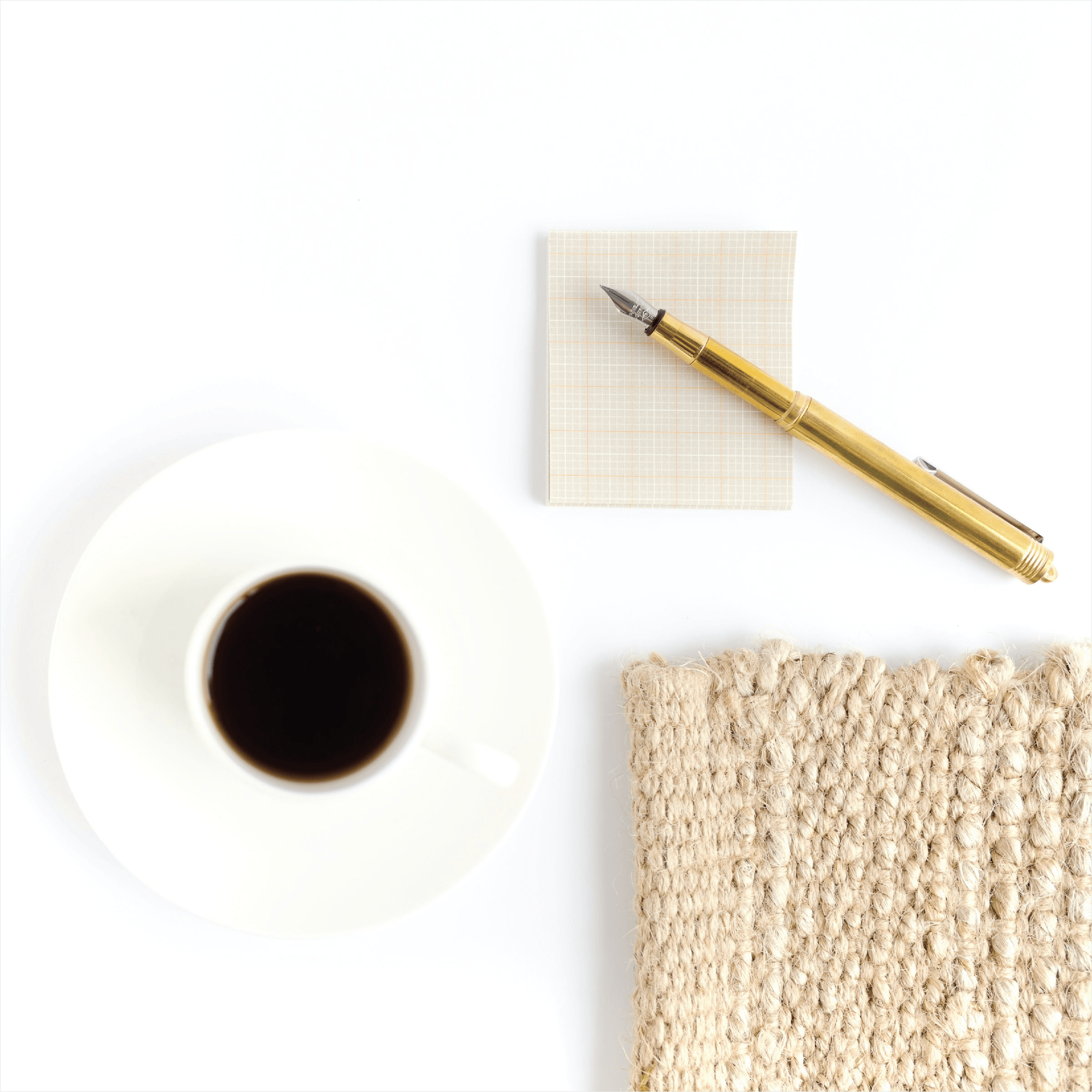 Journal, coffee, and notebook representing a calm space for reflection.