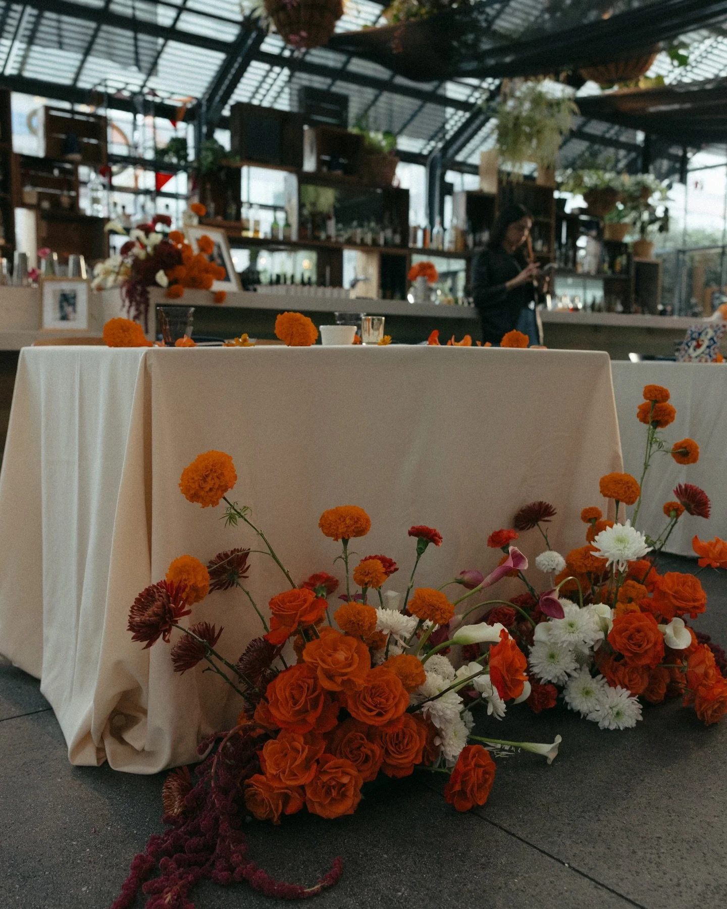 L+J told their love story beautifully through every detail of their dinner celebration. Having shared a private elopement in Mexico City, they wanted to bring that piece of their journey to the people they love most. Marigolds anchored the floral des