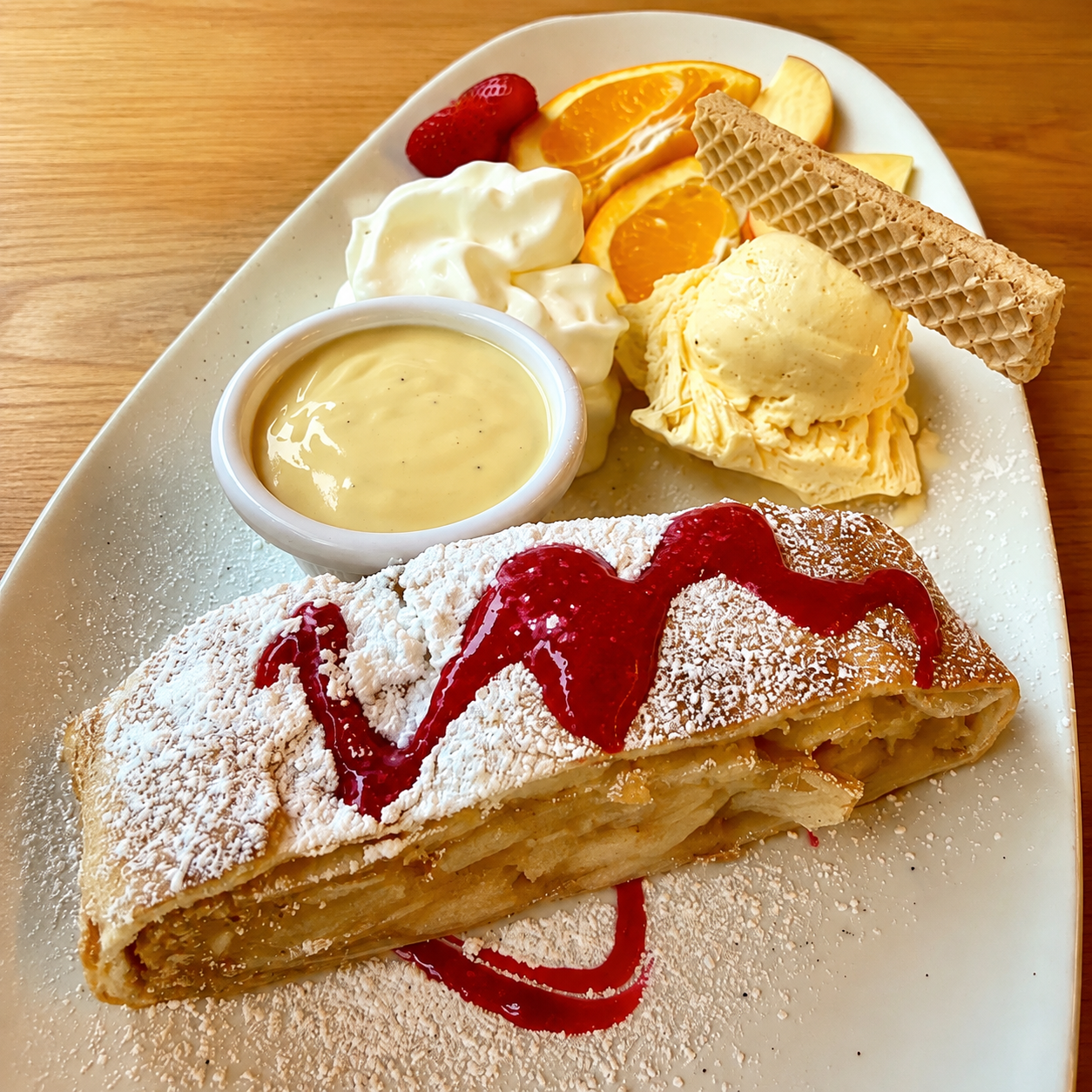 German Apple Strudel with Vanilla Ice Cream and Vanilla Sauce