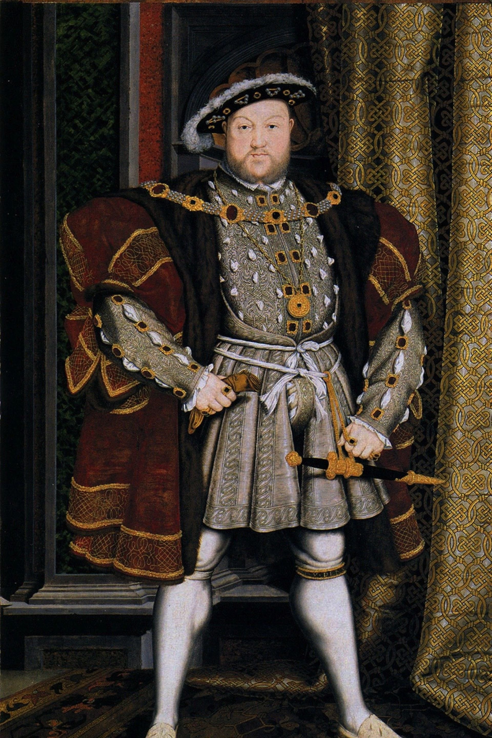 Painting of a king dressed in medieval royal clothing, standing with one hand on his waist and the other holding a scepter. He is wearing a crown, ornate jewelry, and a richly decorated outfit, with a patterned curtain behind him.
