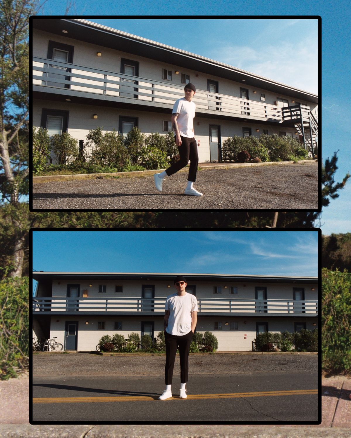 Two young men standing outside in front of a beige apartment building with a blue sky overhead. One man is walking, wearing a white t-shirt, black pants, white shoes, and a black beanie. The other man is standing with his hands in his pockets, wearing a white t-shirt, black pants, white shoes, sunglasses, and a black beanie.