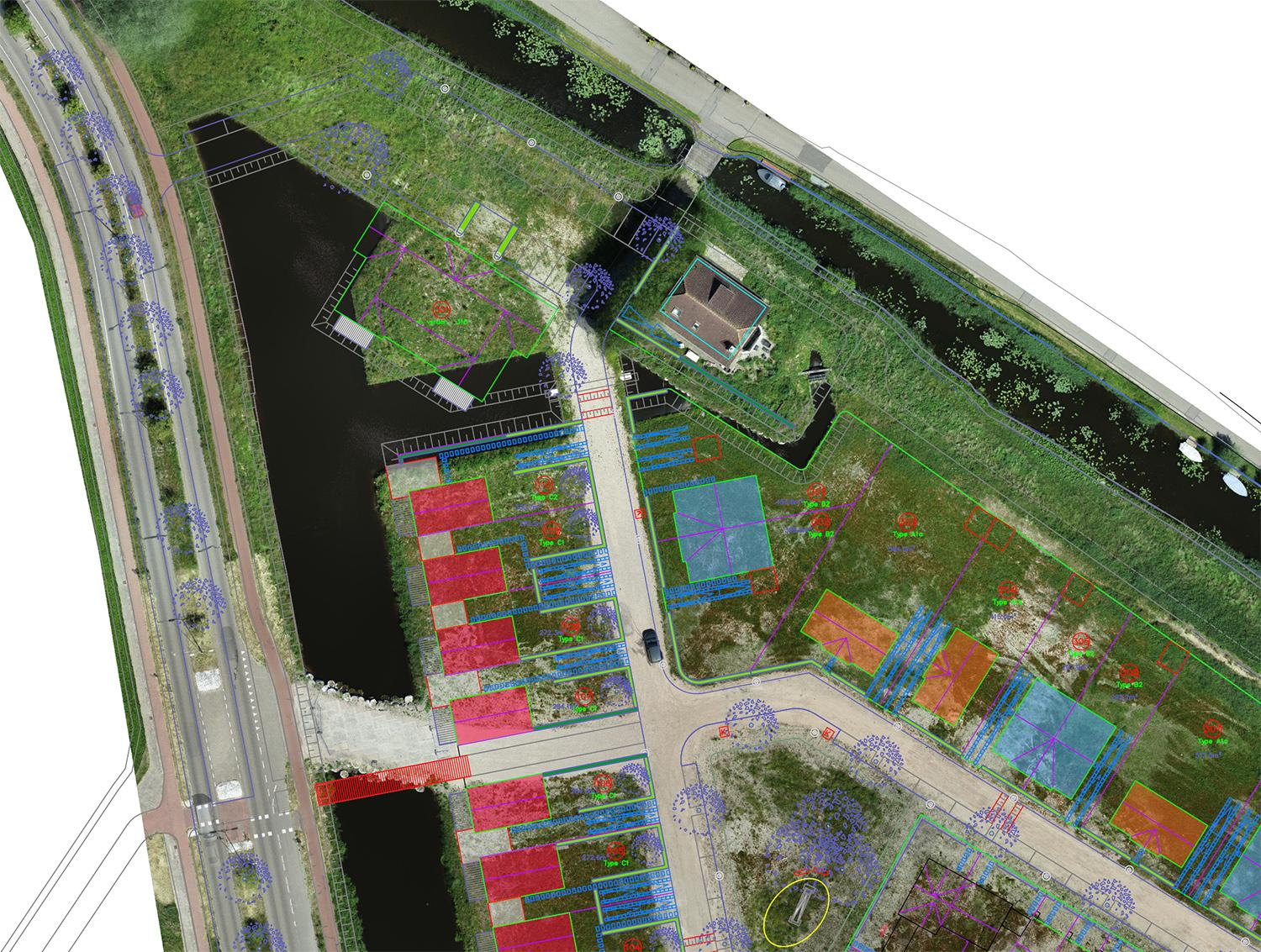 Aerial view of a construction site with mapping and layout plans overlaid on the ground, including water bodies, trees, roads, and a small building.