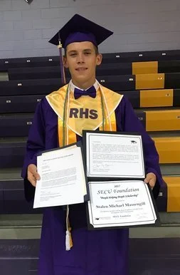 2017 scholarship recipient, Stalen Massengill, posing with his award certificate and letter