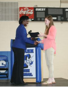 2016 scholarship recipient, Kristina Collier, receiving her award certificate from LKR Scholarship representative, Tosha Diggs