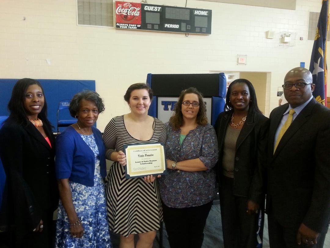 2015 scholarship recipient, Kodie Brandon, receiving her award certificate from LKR Scholarship representatives, Jerry Raynor, Tosha Diggs, Katie Raynor, and Cassandra Simpson