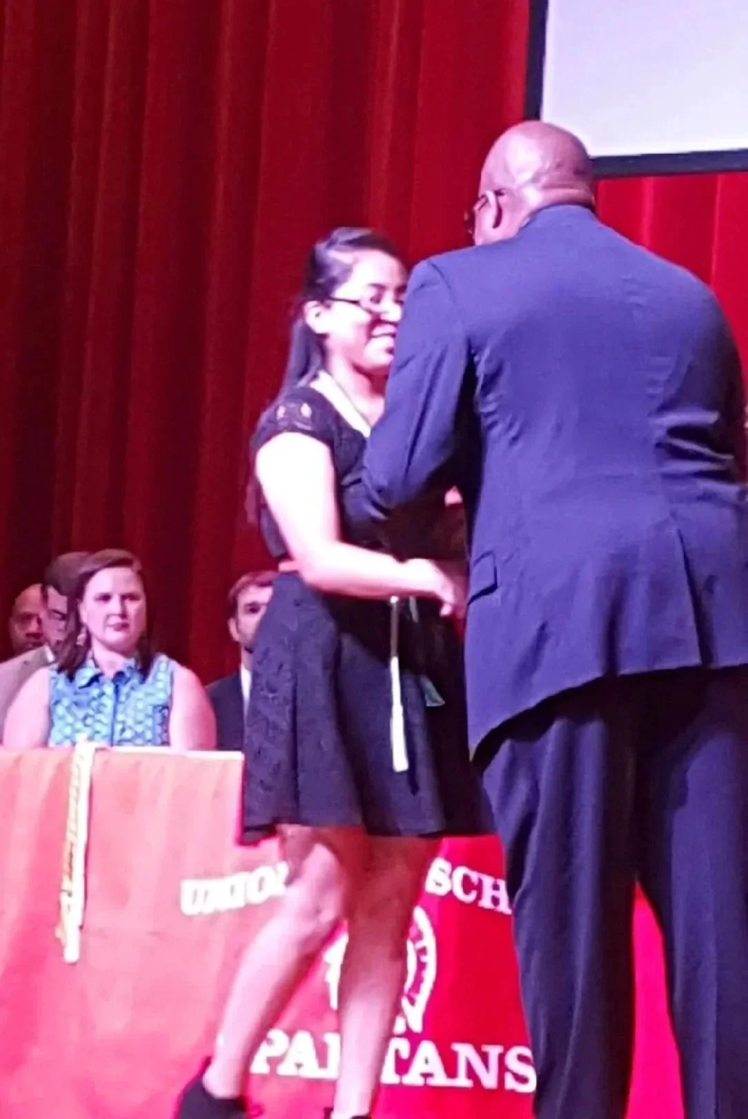 2016 scholarship recipient, Iris Cruz-Cruz, receiving her award certificate from LKR Scholarship representative, Jerry Raynor