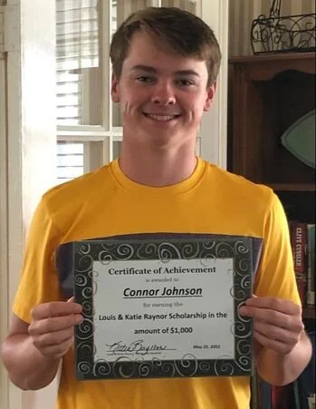 2022 scholarship recipient, Connor Johnson, posing with his award certificate