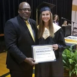 2018 scholarship recipient, Sarah Wallace Strickland, posing with her award certificate and LKR representative Jerry Raynor