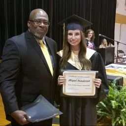 2018 scholarship recipient, Abigail Henderson, posing with her award certificate and LKR representative Jerry Raynor
