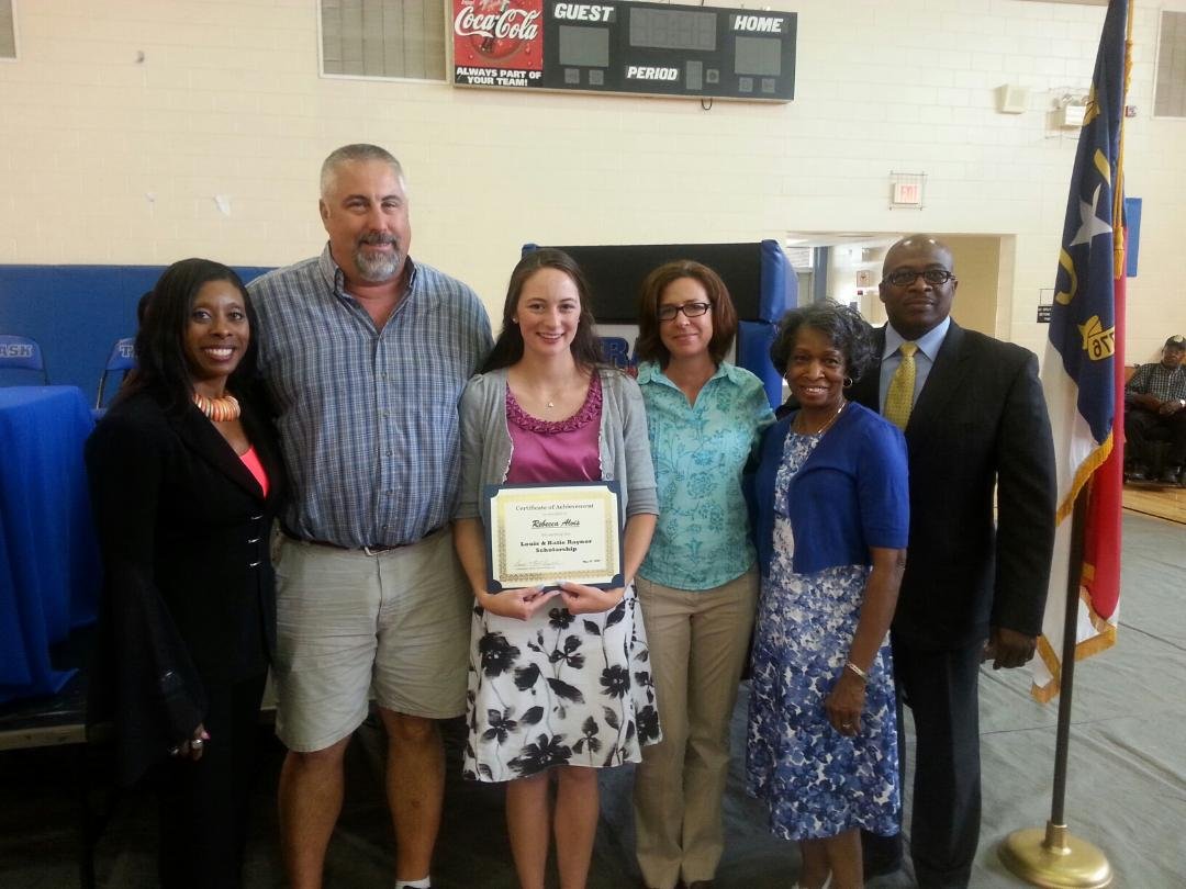 2015 scholarship recipient, Rebecca Alvis, and her family receiving her award certificate from LKR Scholarship representatives, Jerry Raynor, Katie Raynor, and Cassandra Simpson