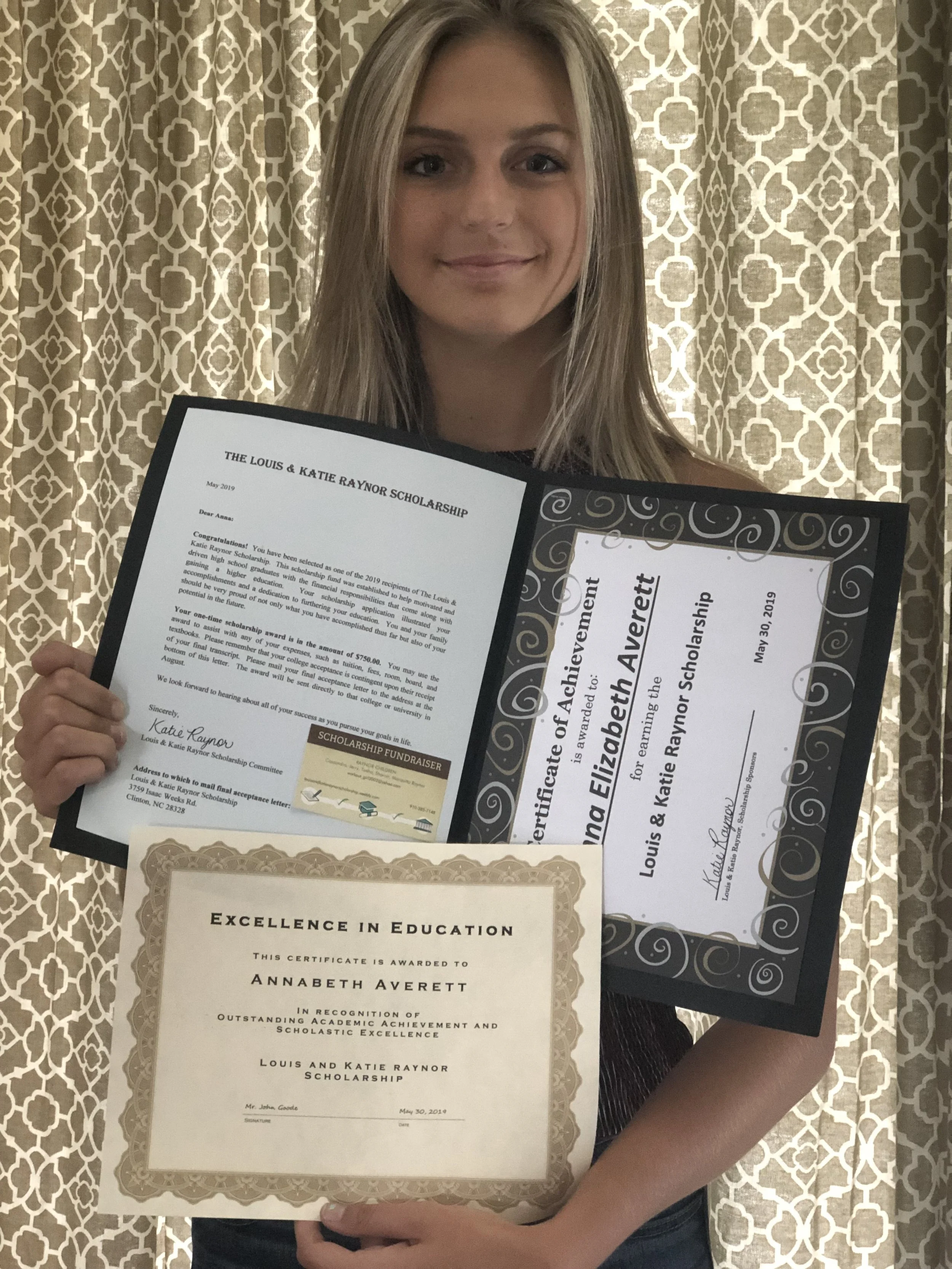 2019 scholarship recipient, Ann Elizabeth Averett, posing with her award letter and certificate
