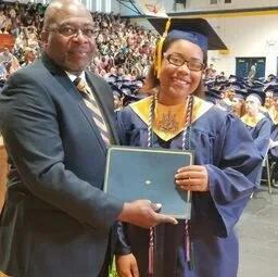 2018 scholarship recipient, Raven Raynor, posing with her award certificate and LKR representative Jerry Raynor
