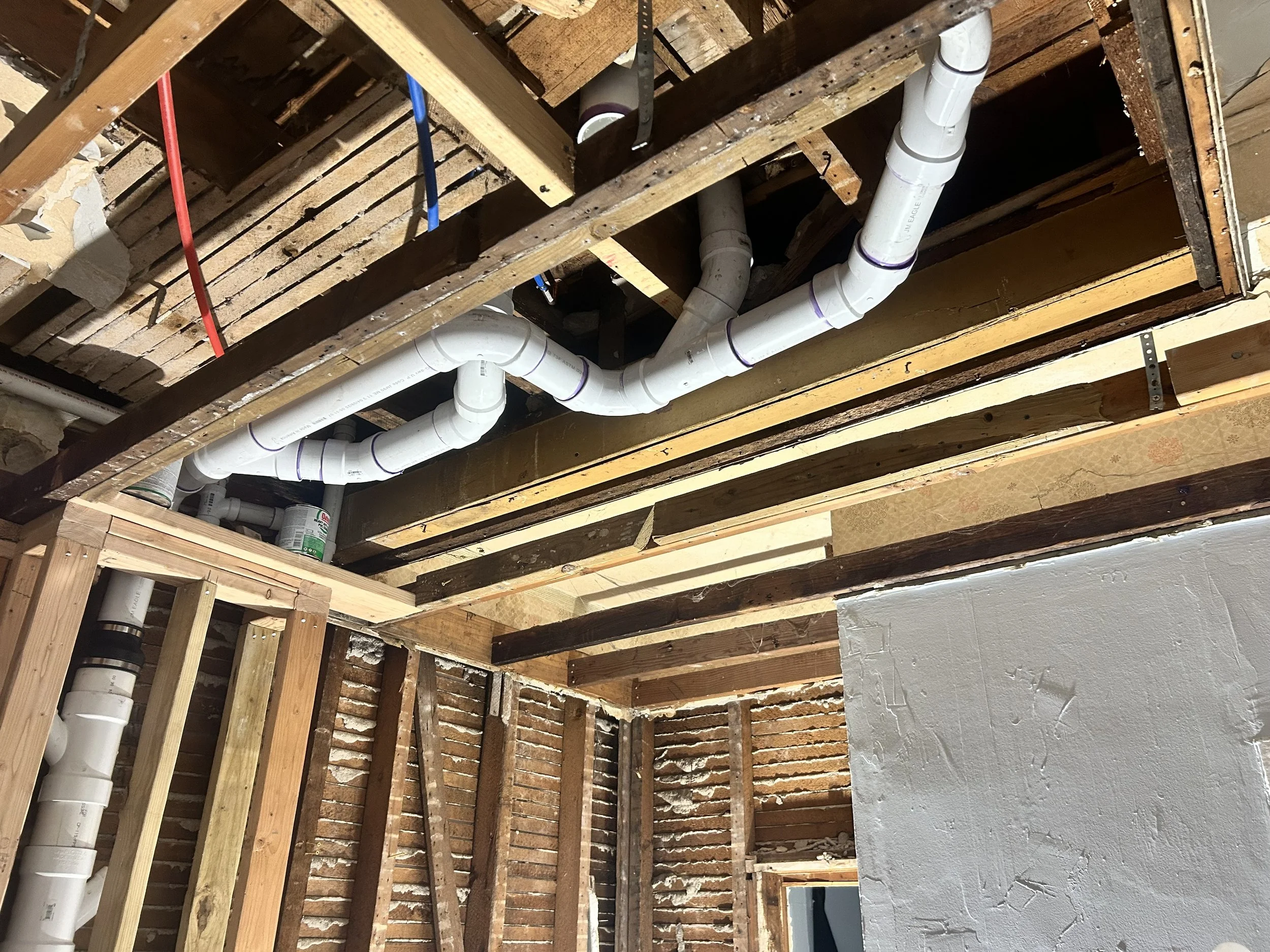 remove cast iron pipe; replace with plastic