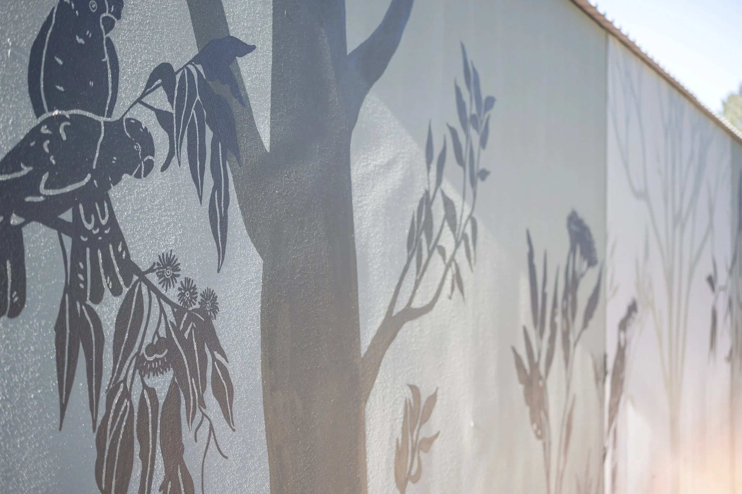 Close up of a mural painted by Annabelle Denniss depicting native flora and fauna, shadow style