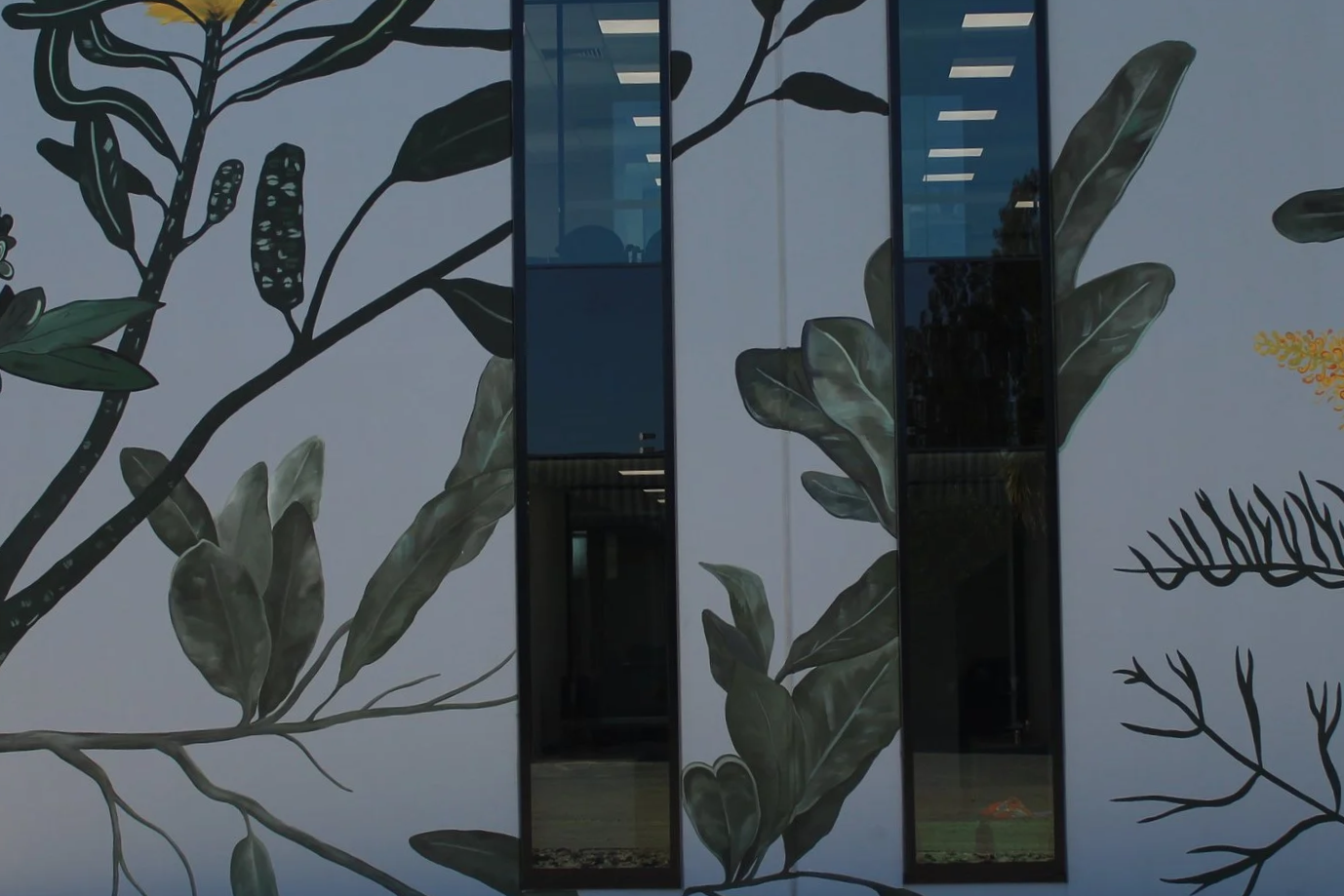Exterior office mural in Belmont featuring yellow Australian native flowers In Belmont, Perth
