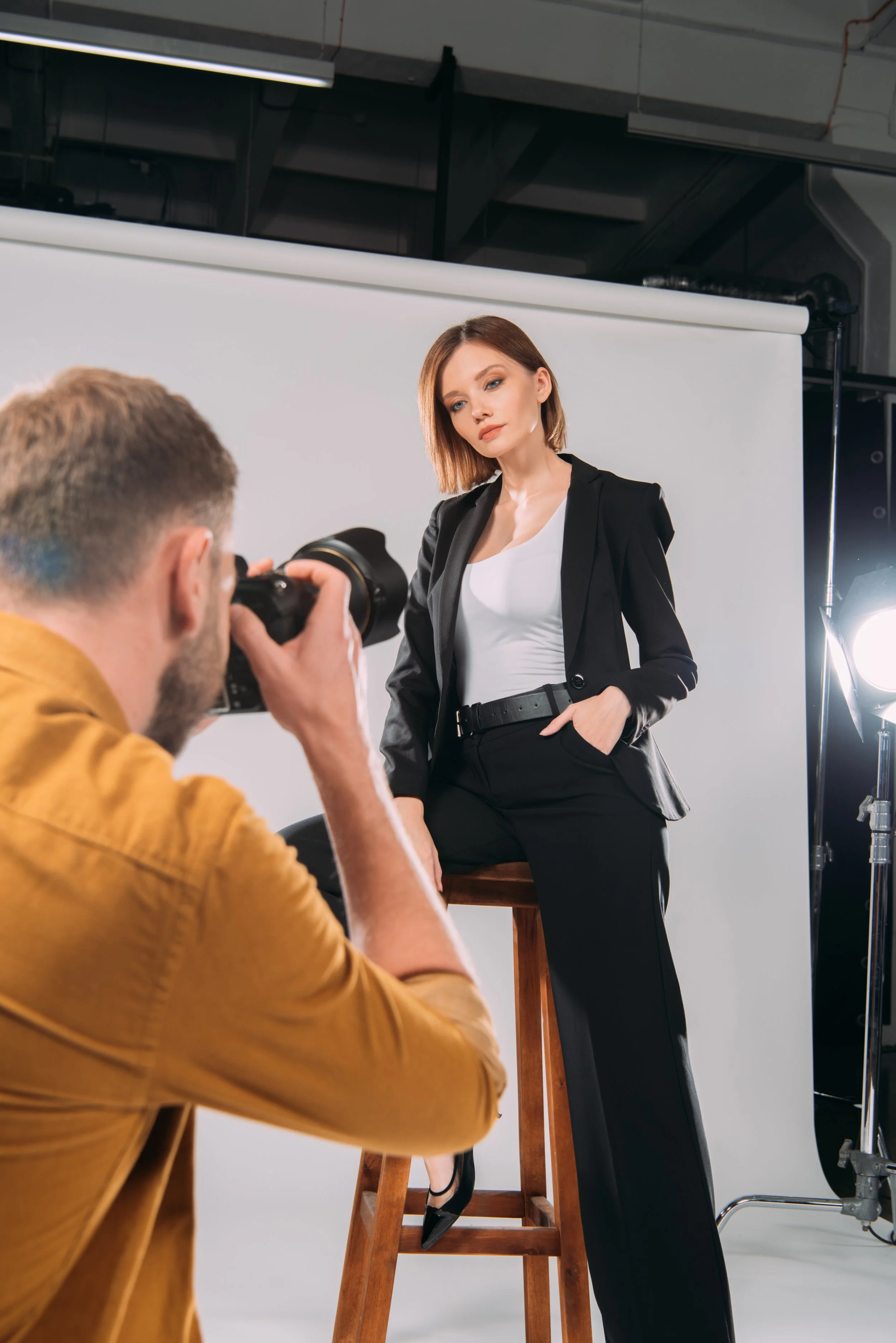 selective-focus-of-elegant-model-posing-on-chair-a-2026-01-09-12-25-37-utc.jpg