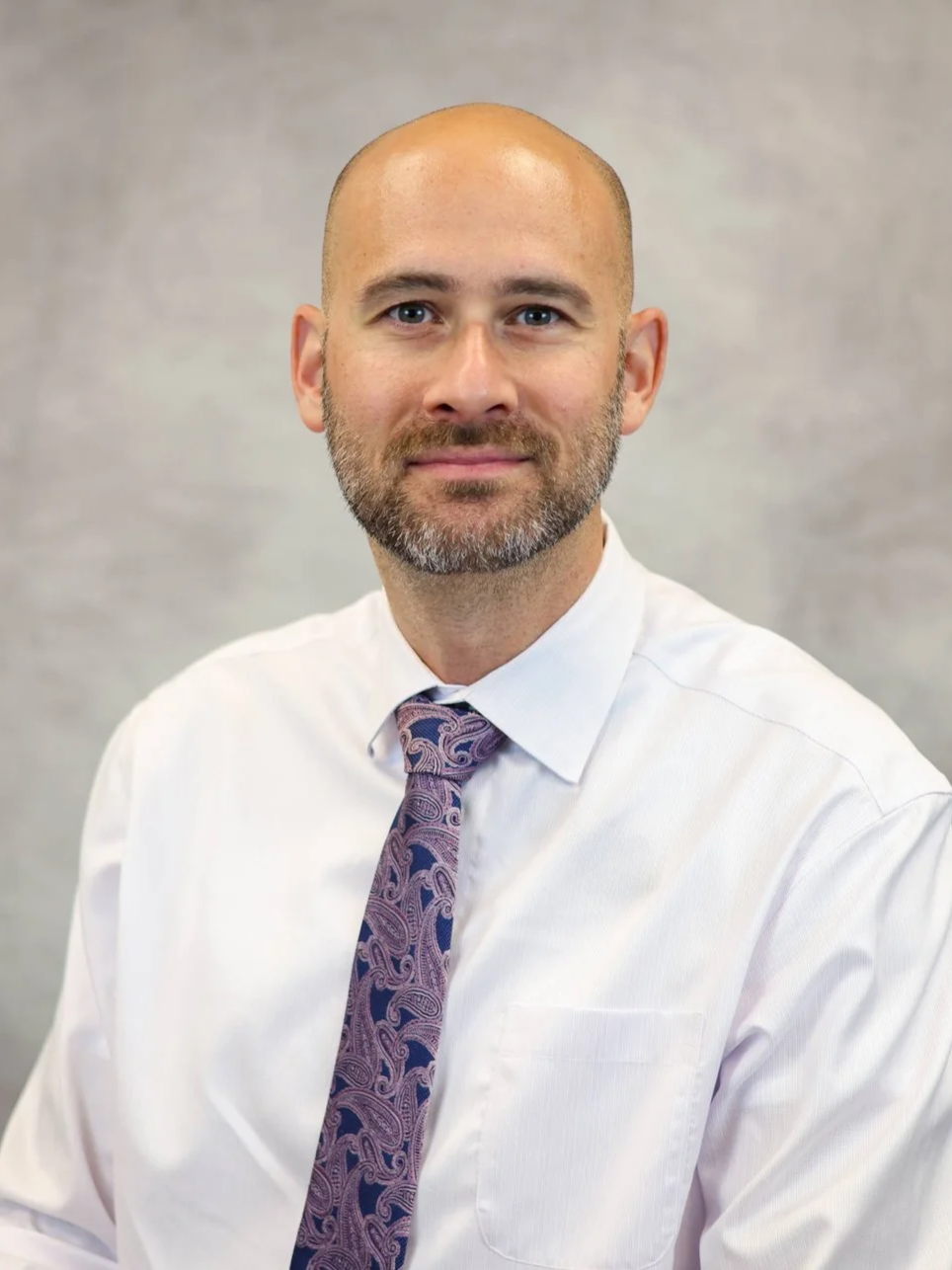 A headshot of Jason Adams