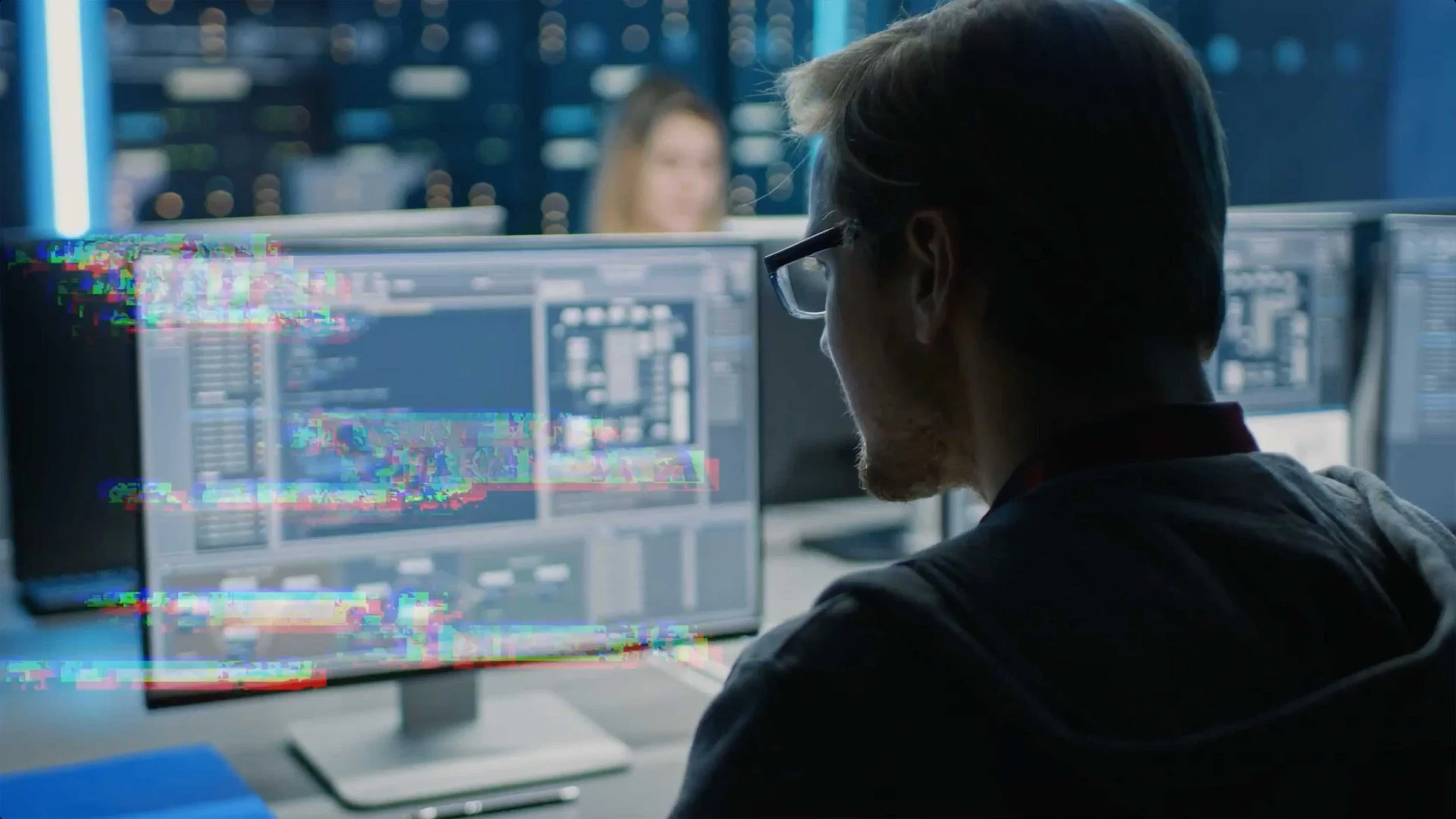 A man looks at a computer in a data storage cloud business commercial