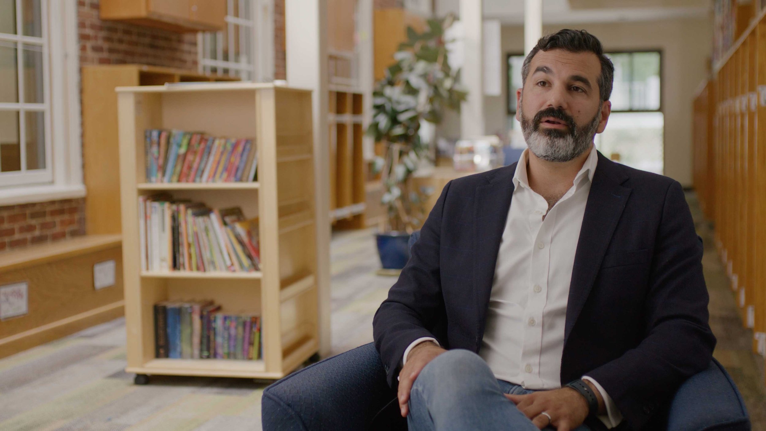 An interview frame from the Bright Bold Next capital campaign for BBN School