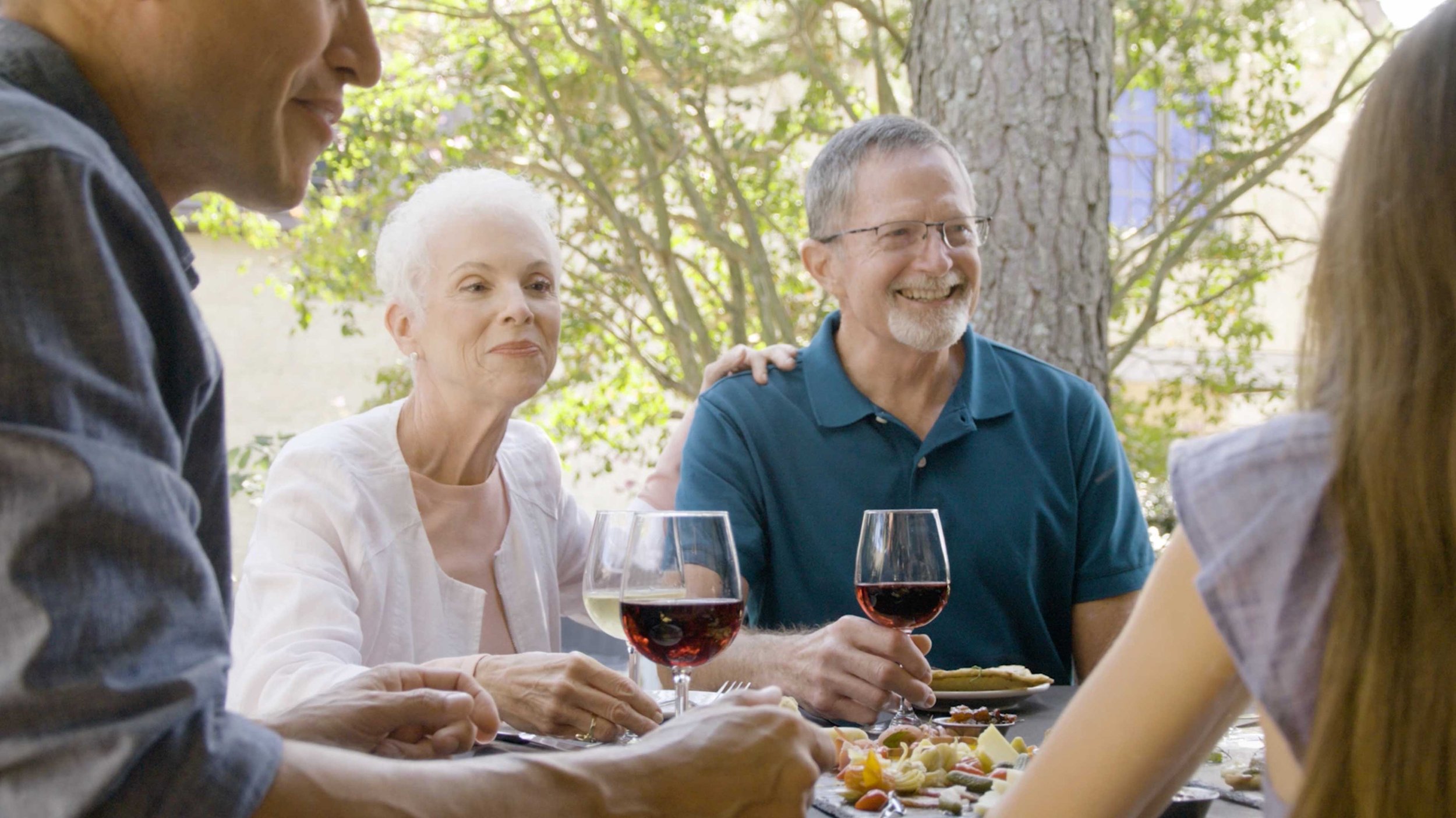 A couple drink wine at a restaurant in this city of Williamsburg, VA travel video