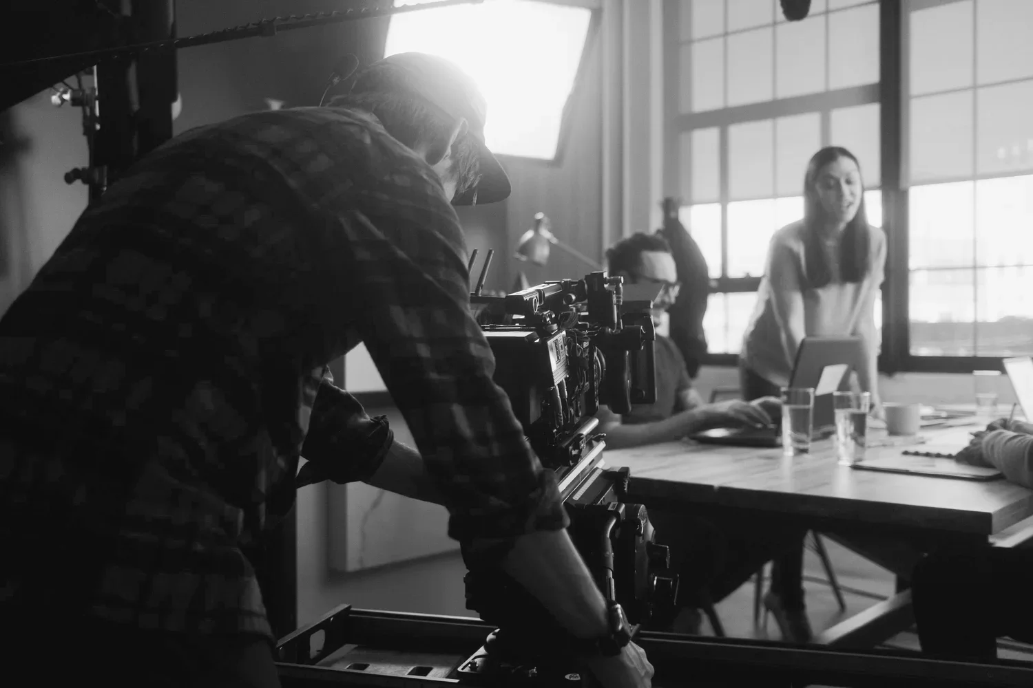 The cinematographer sets the camera in position for a commercial video scene