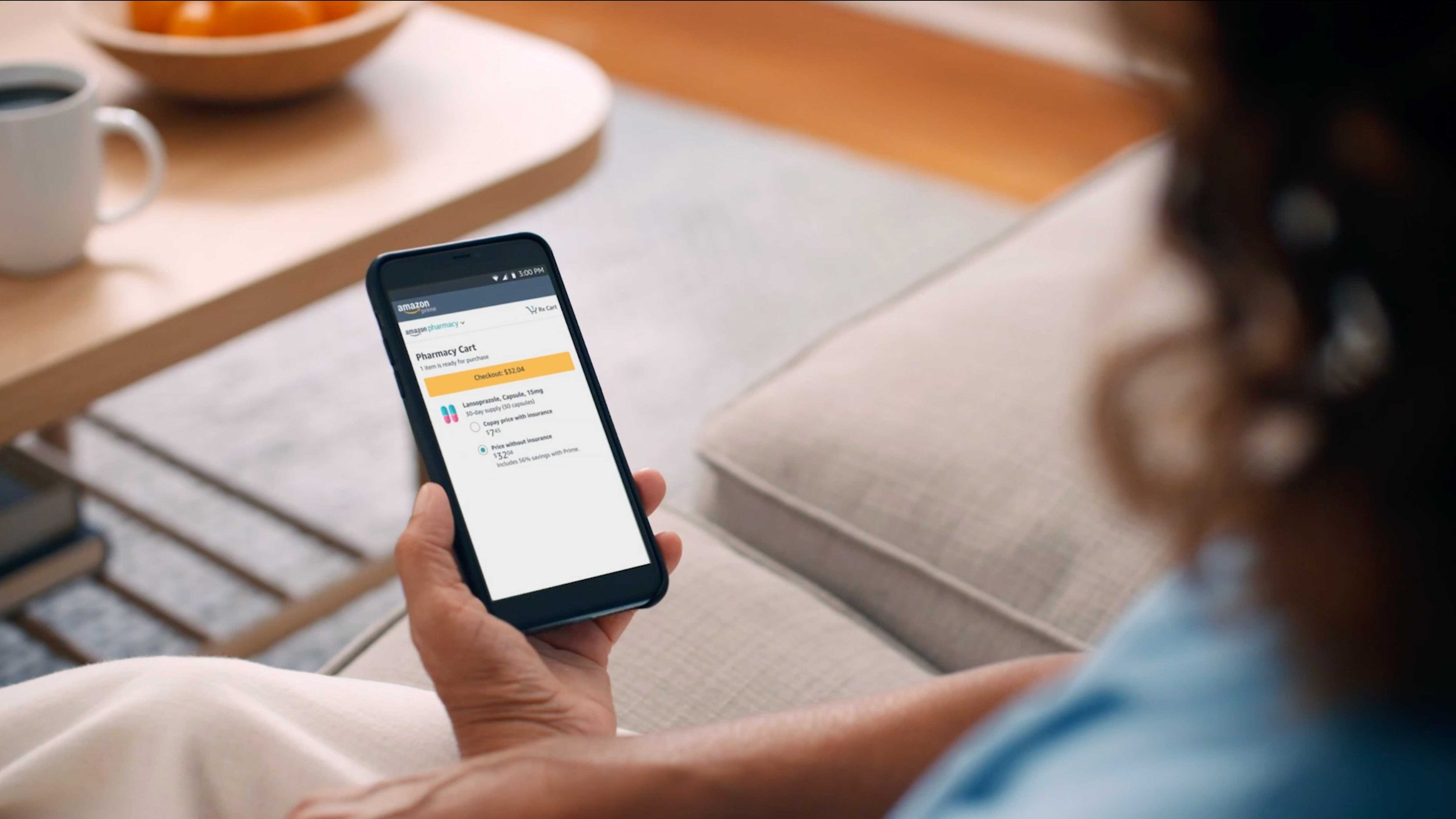 Amazon Pharmacy commercial showing mobile prescription ordering on a smartphone