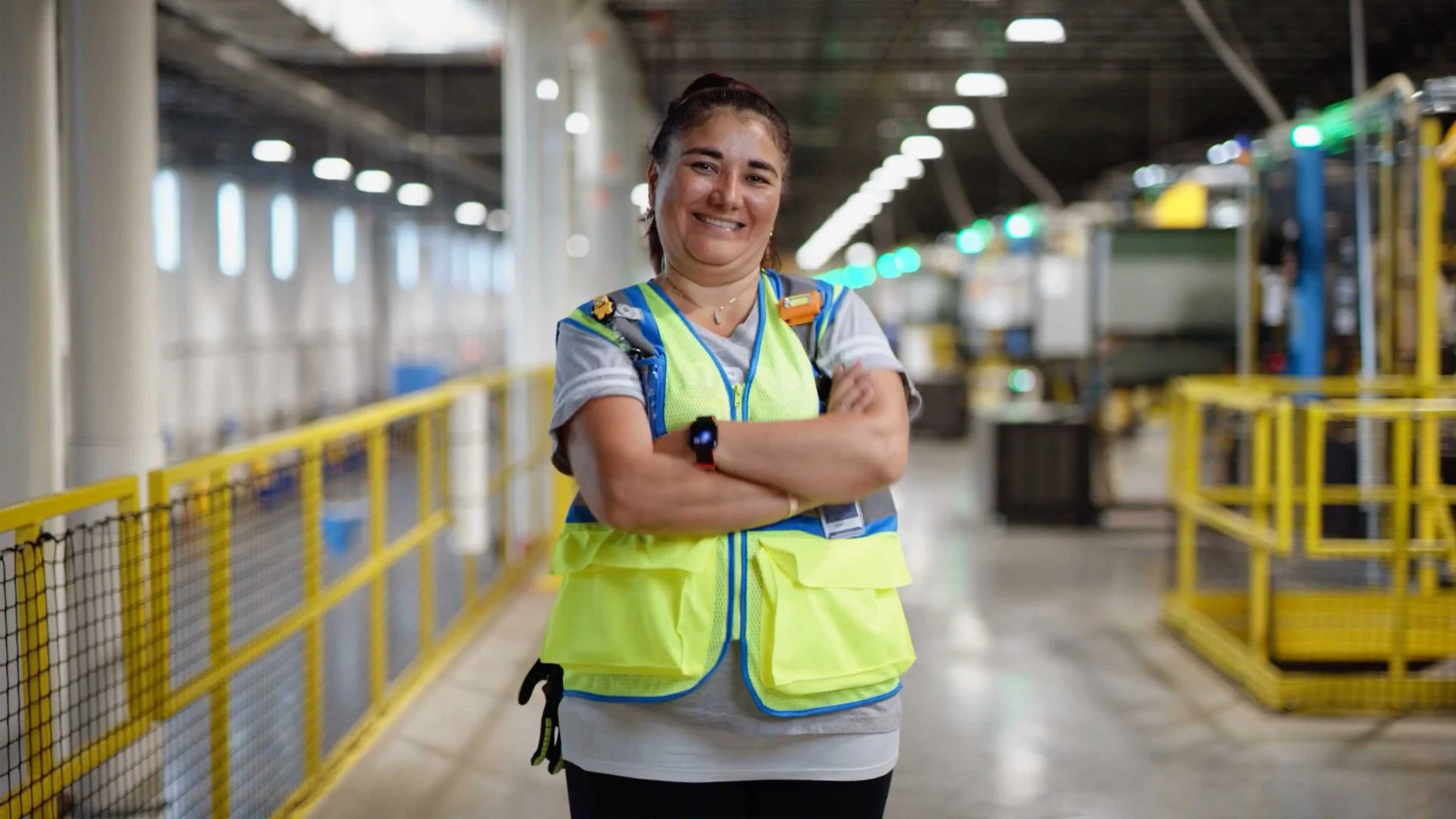 Lina Hernandez Amazon Robotics Associate smiles at the camera in a documentary video