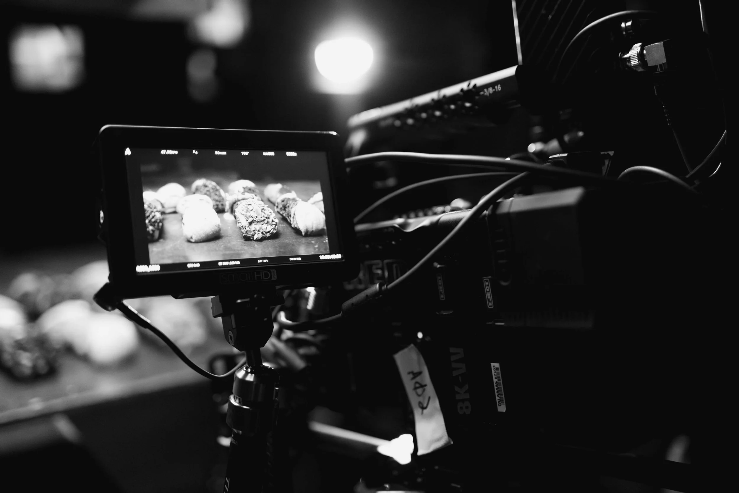 Close up behind the scenes shot of the camera monitor on a shoot for a bakery