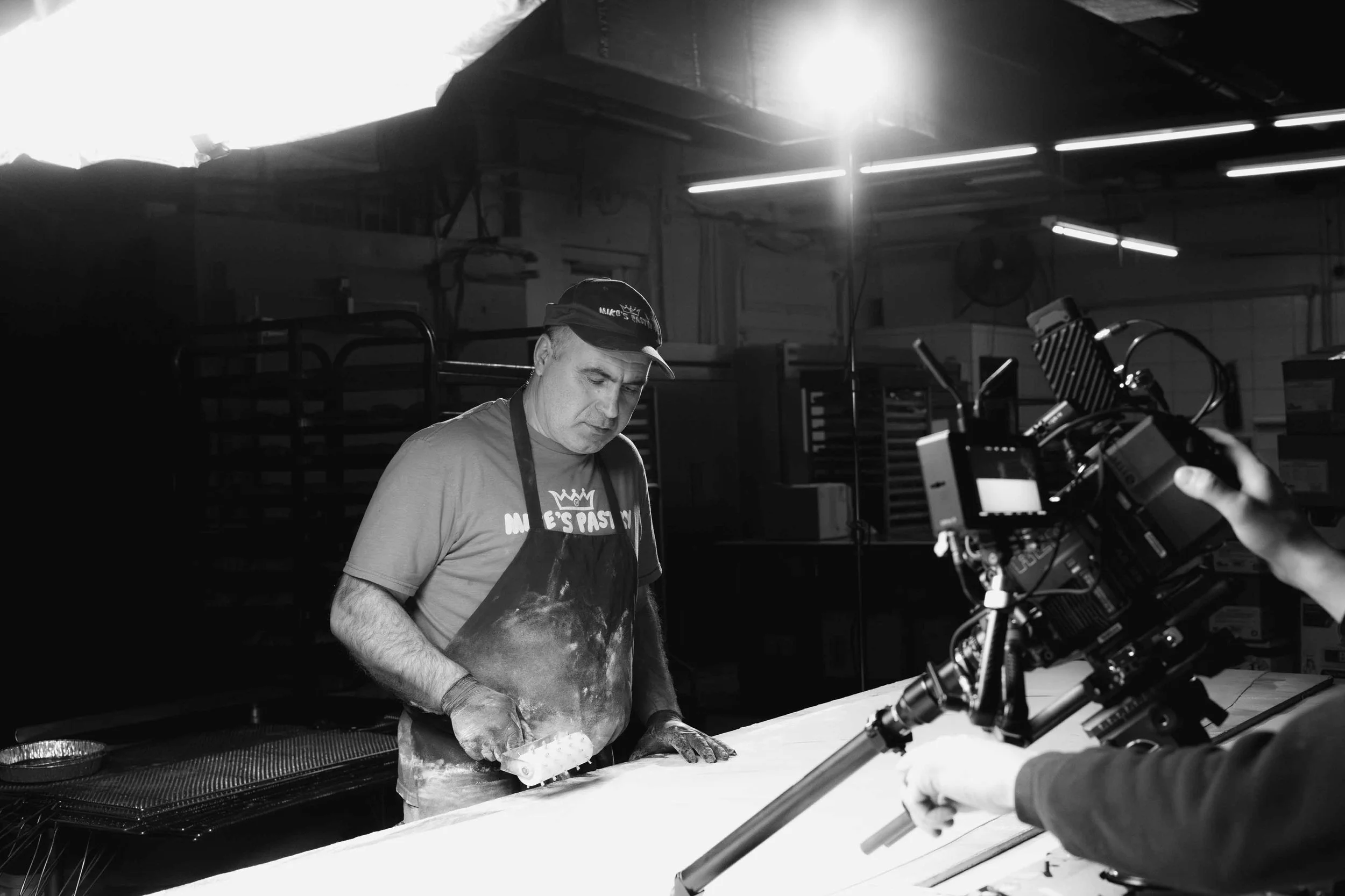 A behind the scenes photo from a shoot with a creative agency at Mike's Pastry in Boston