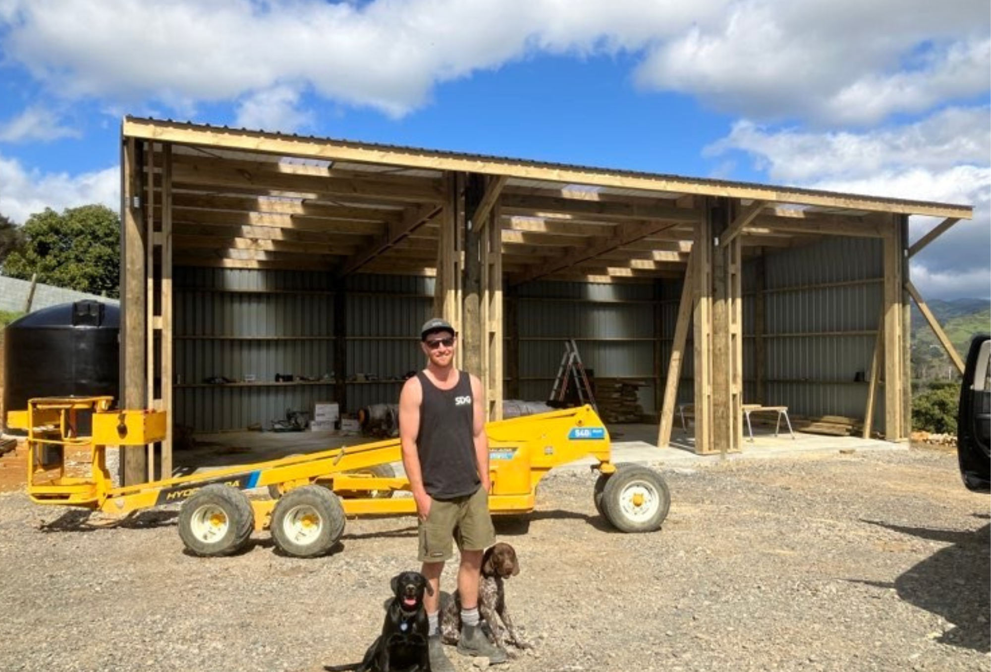 Owner Sam gregan.  Hydra Lader in background.  3 bay wooden pole shed.  Consent free in Waihi , Katikati area. Barn for boats and machinery.