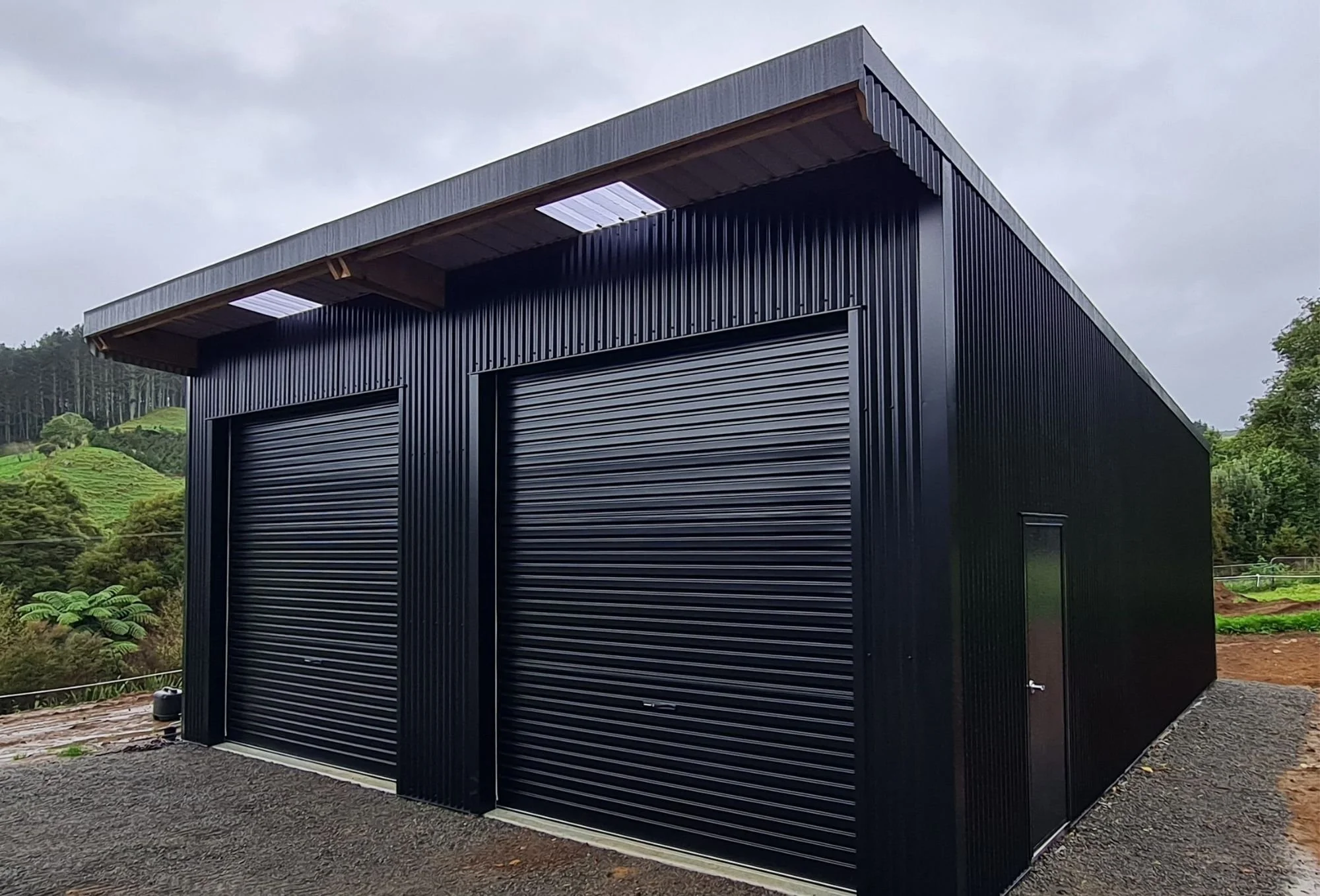 2 bay wooden pole shed.  Consent free in Katikati, Aongatete area. Iron sand colour. Rural  Farm Shed