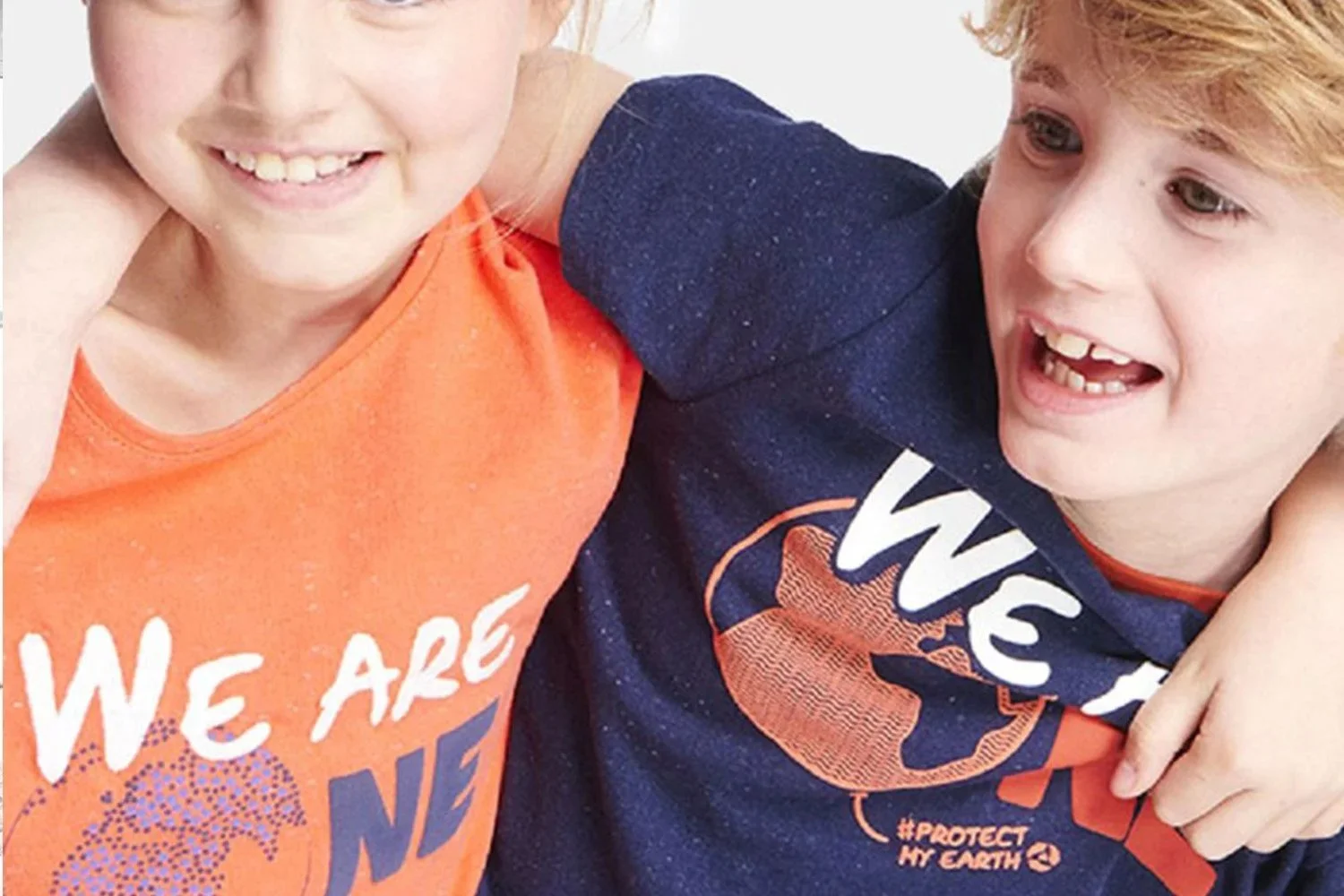 Young children wearing Okaidi Tee-shirt