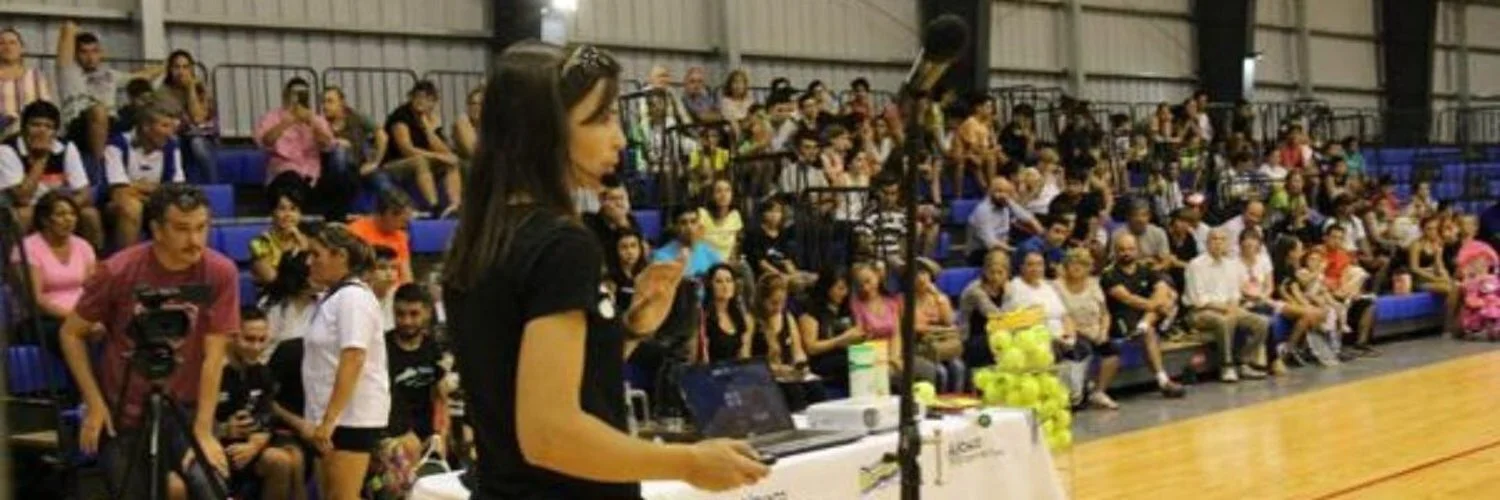 The photo in which Dr. Silvina Delgado is presenting is in the city Resistencia province of Chaco, Argentina. In a sports stadium she is doing the presentation of the Cardiotenis Foundation for life and explaining the importance of physical activity…