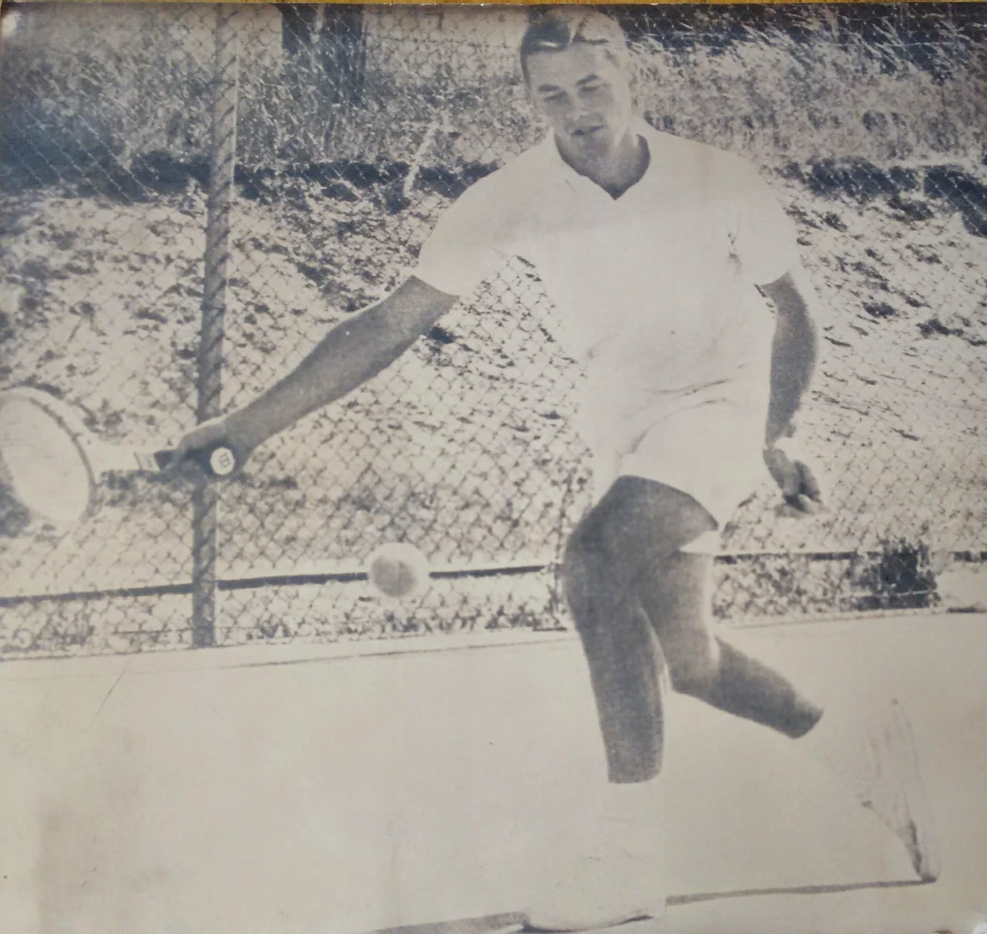 College action shot of John playing in a match vs. Oregon
