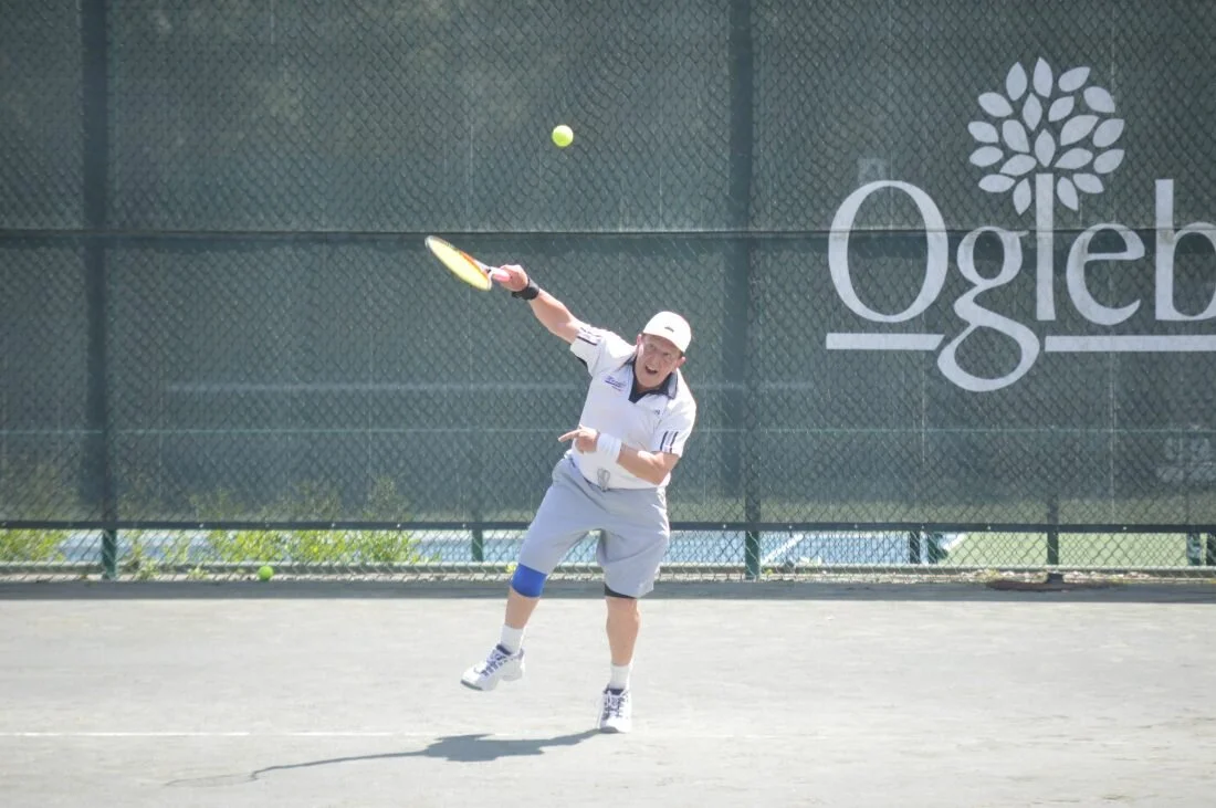 Alex Kor serves the ball during his match at the Jack Dorsey Memorial Senior Tennis Tournament (Photo by Kyle Lutz )
