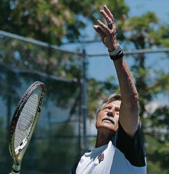 Jimmy Parker practices Friday at the Santa Fe Tennis and Swim Club. Parker has been competing in tennis for more than 60 years. Photo Courtesy Luis Sánchez Saturno/The New Mexican