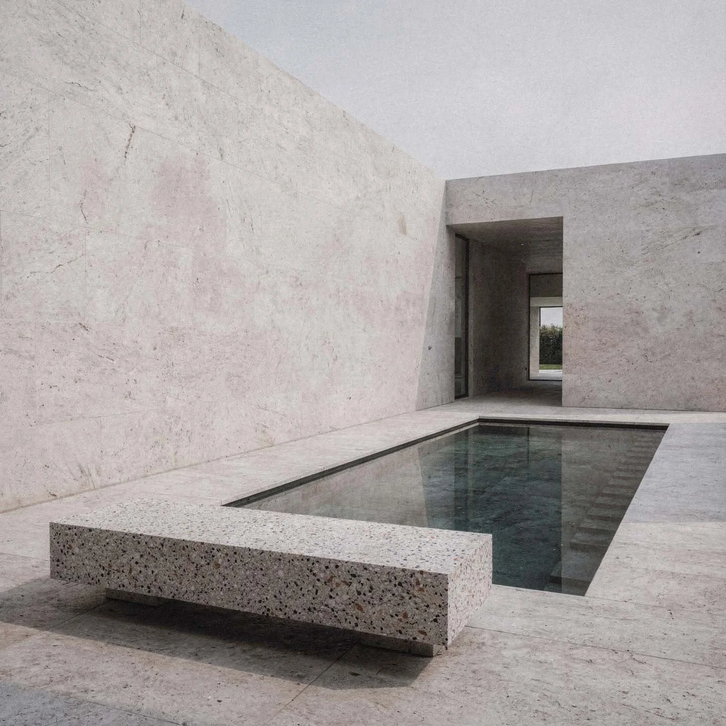 Una piscina coperta in un ambiente minimalista con pareti di pietra chiara e una finestra aperta su uno sfondo naturale.