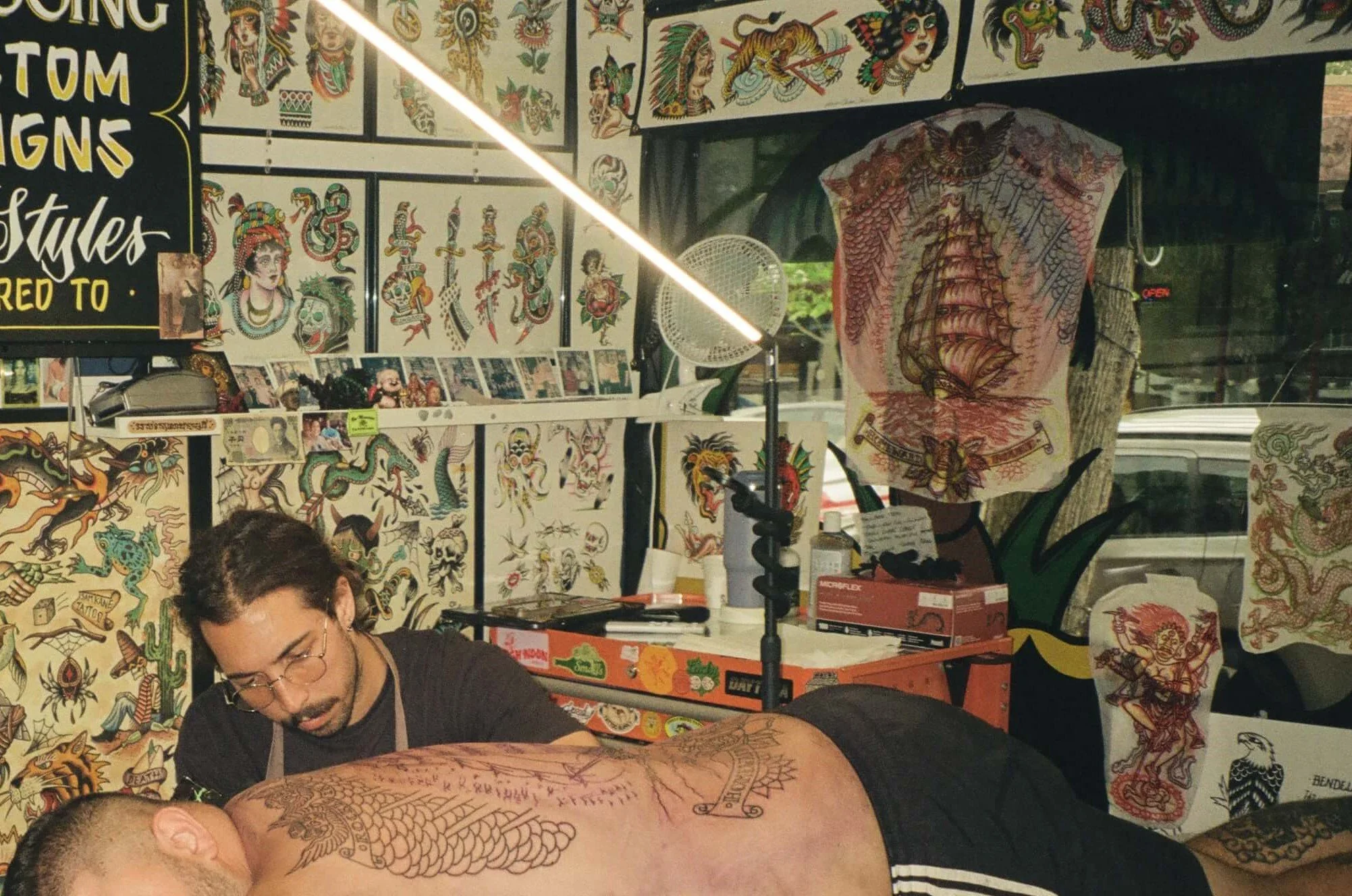 Sutherland Shire Tattoo Artist making backpiece tattoo on client