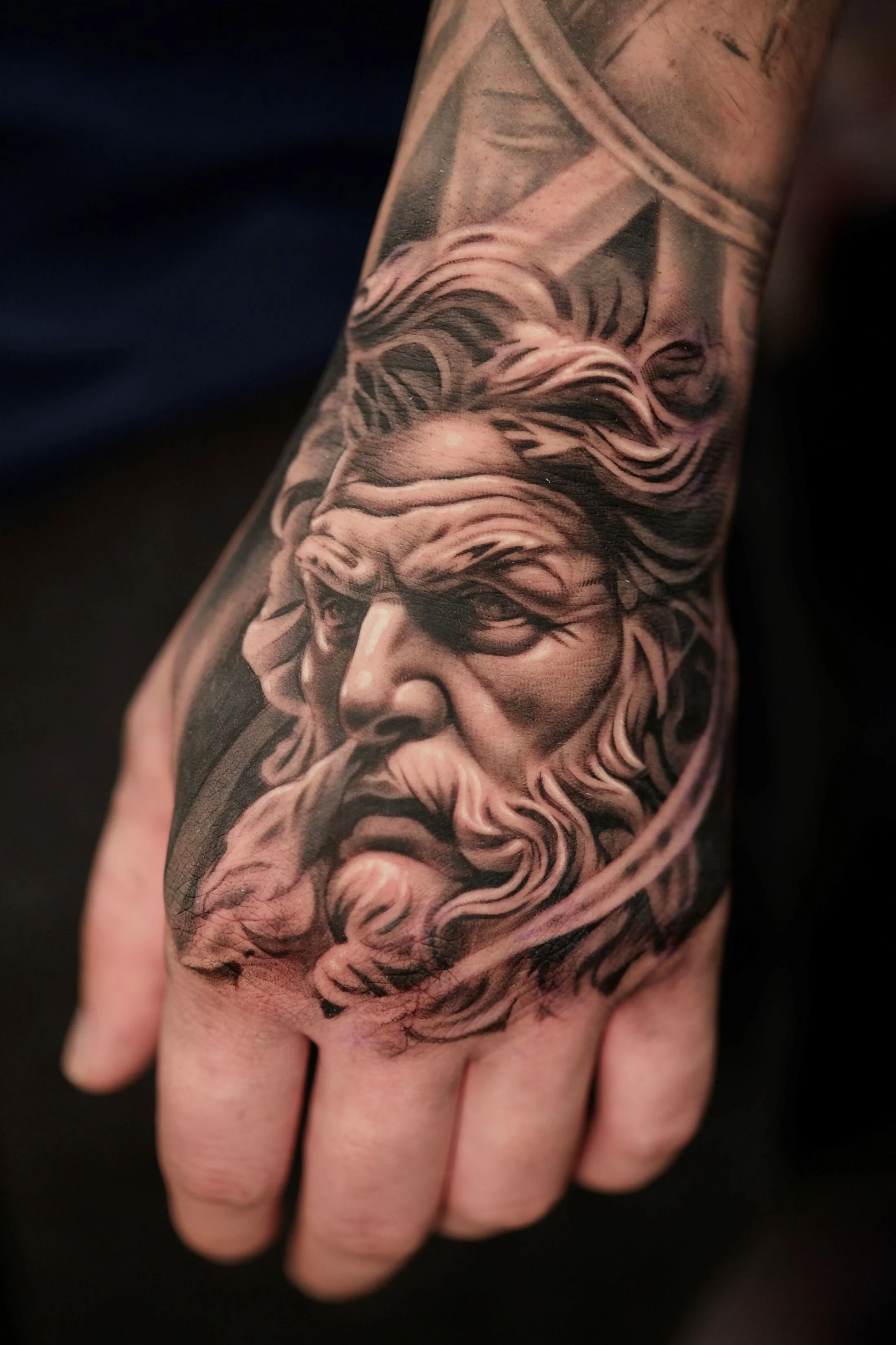 ciaran-harrington-zeus-portrait-hand-black-and-grey-tattoo-cambridge.jpg