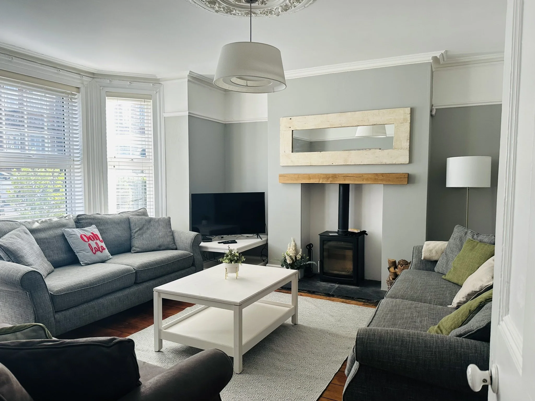 Large living room, sundrenched through large bay windows, for the whole family to get away together, read a book in front of the log burner, play a game or watch a film together.