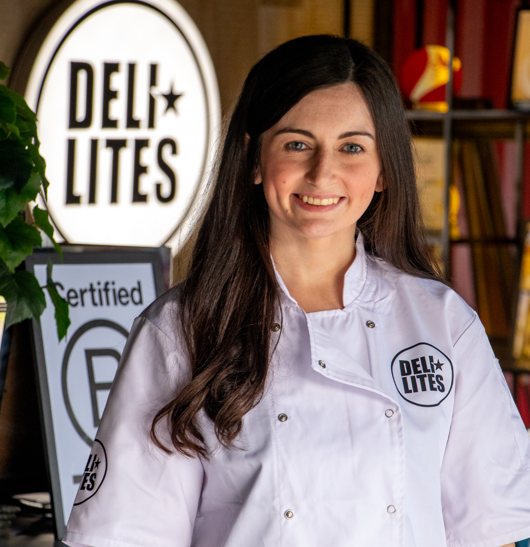 A woman in a white chef's coat with