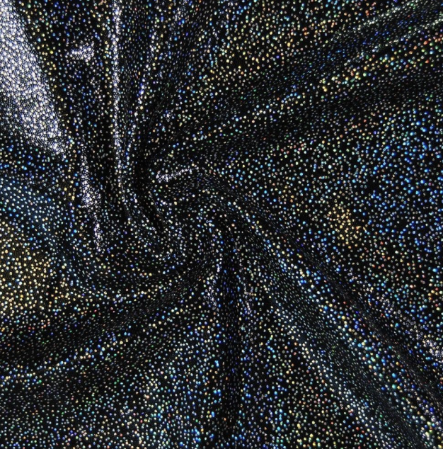 Black fabric with multicolored tiny rhinestones creating a swirling pattern.