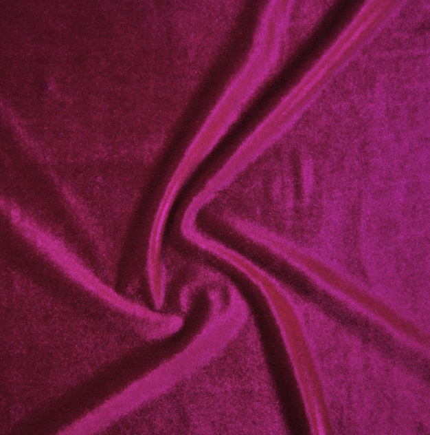 Magenta-colored fabric twisted into a spiral pattern.